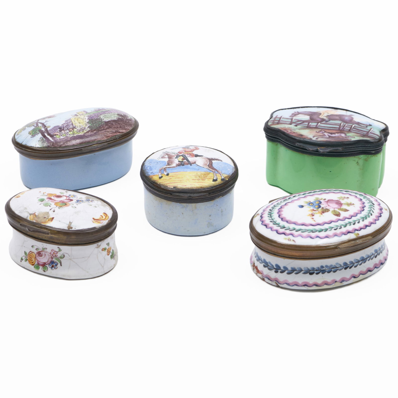Group of Five Staffordshire Enamel Pill Boxes: Group of Five Staffordshire Enamel Pill Boxes Comprising: Two equestrian hunt boxes Two oval white ground boxes, one with mirror inside cover An oval box with landscape The largest 5/8 x 2 1/4 x 1 3/4