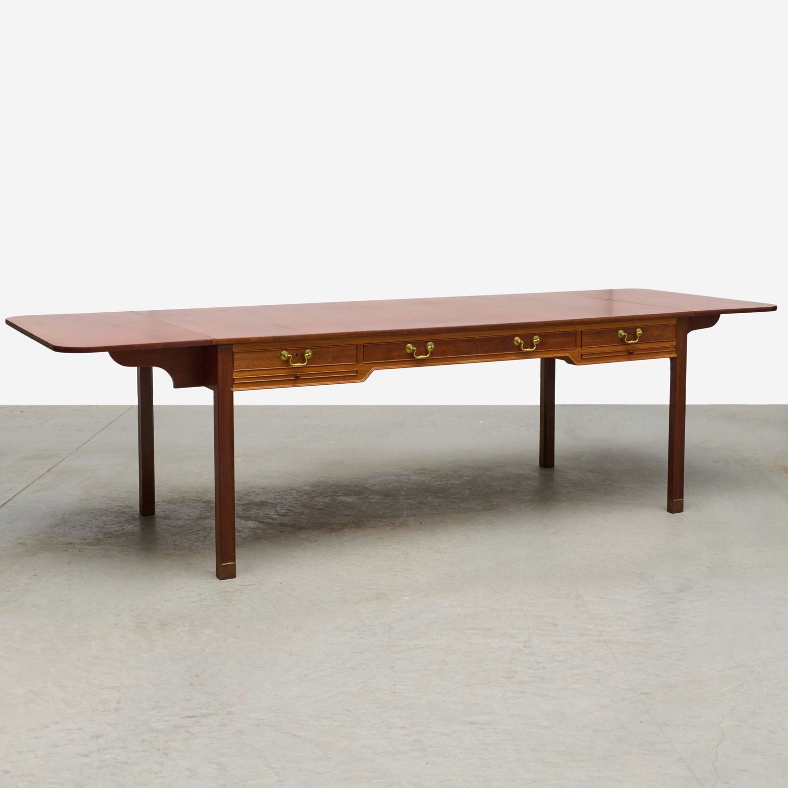 Kaare Klint for Rud. Rasmussen Model 4113 Mahogany Drop Leaf Desk: Kaare Klint for Rud. Rasmussen Model 4113 Mahogany Drop Leaf Desk Fitted with three drawers, and two writing slides. Unmarked. 30 1/4 x 6 ft. 2 in. x 37 in. (closed). 30 1/4 x 9 ft. 2 in. x 37 in. (op