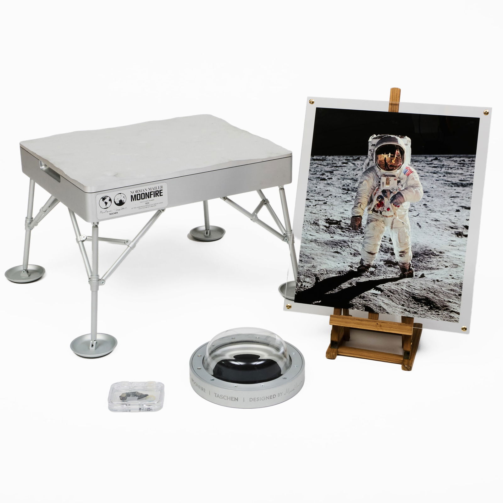 Marc Newson (b. 1963) and Norman Mailer (1923-2007): MoonFire: Marc Newson (b. 1963) and Norman Mailer (1923-2007): MoonFire The bound book with aluminum case, framed print signed 'Buzz Aldrin' on the reverse, lunar rock presentation case and meteorite, all numbe