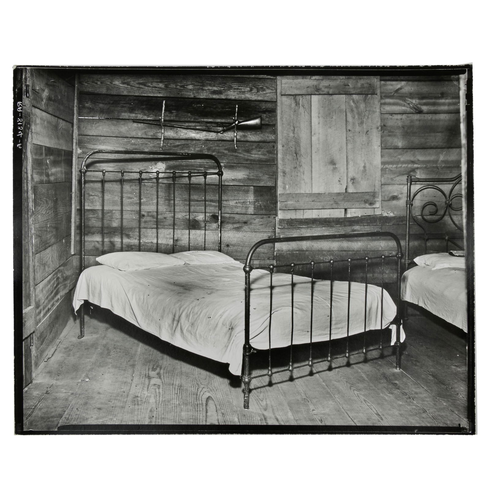Walker Evans (1903-1975): Bed, Tenant Farmhouse, Hale County, Alabama: Walker Evans (1903-1975): Bed, Tenant Farmhouse, Hale County, Alabama Gelatin silver print, 1936, printed c. 1970 by James Dow, unsigned, variously inscribed in another hand on the reverse. 8 x 9 7/8