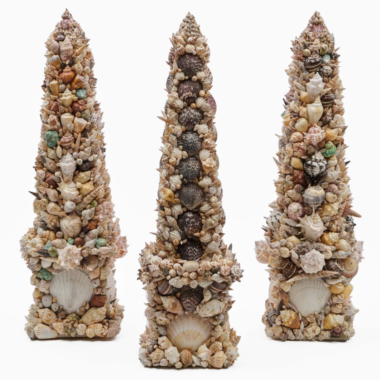 Three Large Shell Encrusted Obelisks: Three Large Shell Encrusted Obelisks 31 x 11 x 11 in.