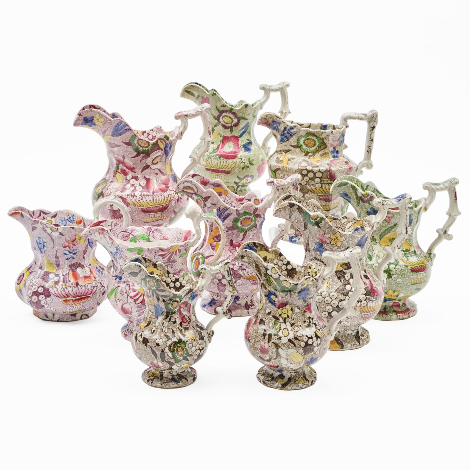 Group of Ten Victorian Transfer Printed 'Chintz' Jugs of Various Size and a Related Book (1 of 20)