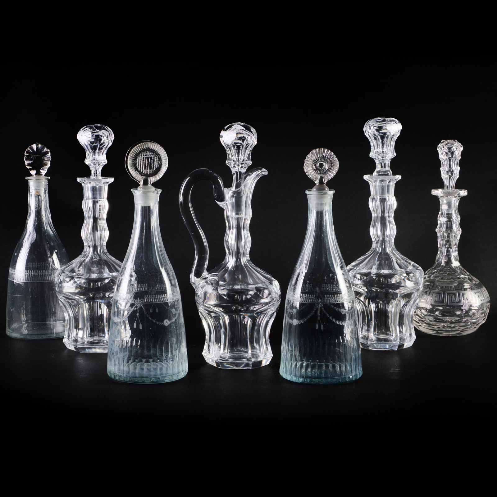 Group of Seven Glass Decanters and Seven Stoppers (1 of 19)