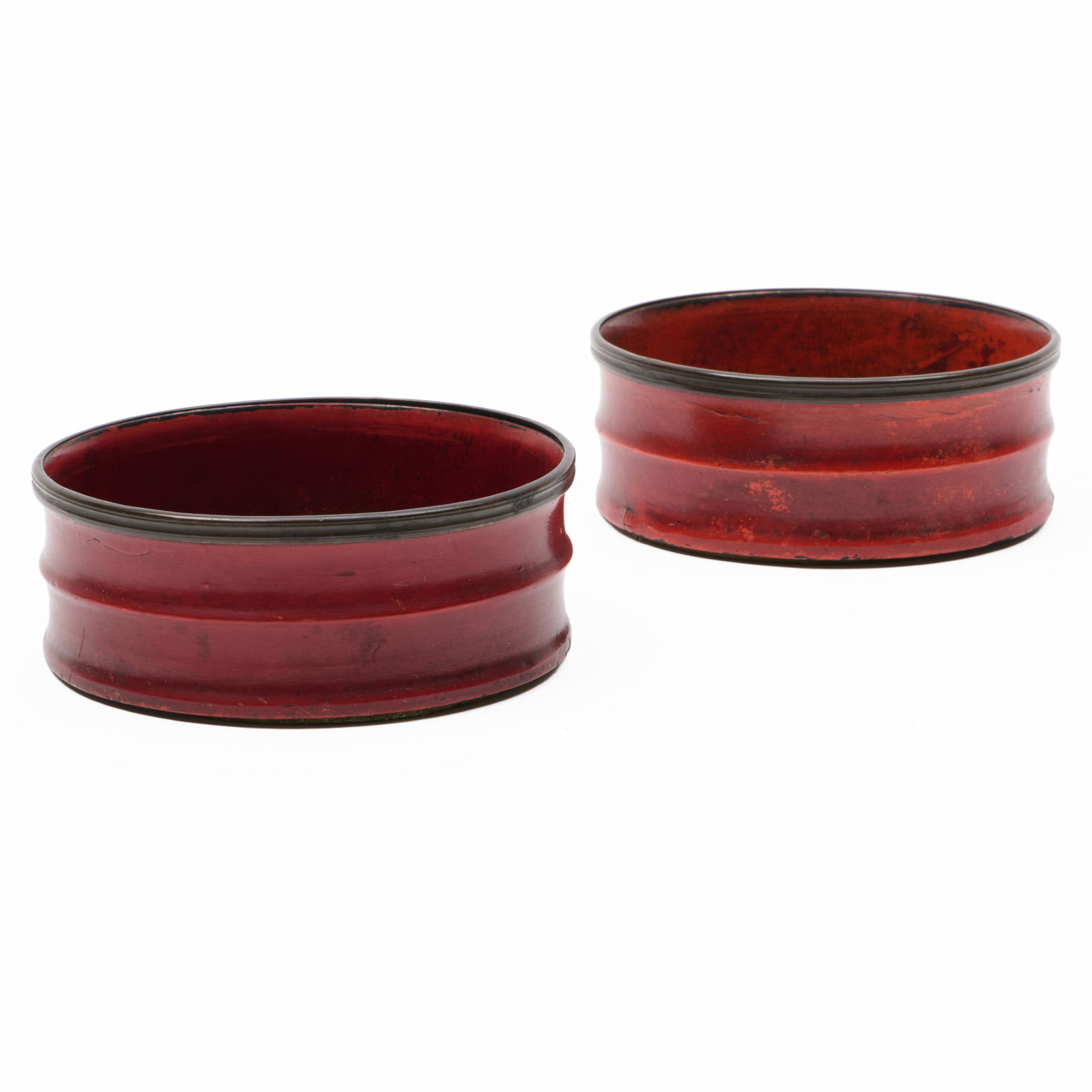 Pair of Victorian Red Papier Mache Bottle Coasters: Pair of Victorian Red Papier Mache Bottle Coasters 2 x 4 3/4 in. diam. The Collection of James M. Labaugh Antiques, Pound Ridge, NY.