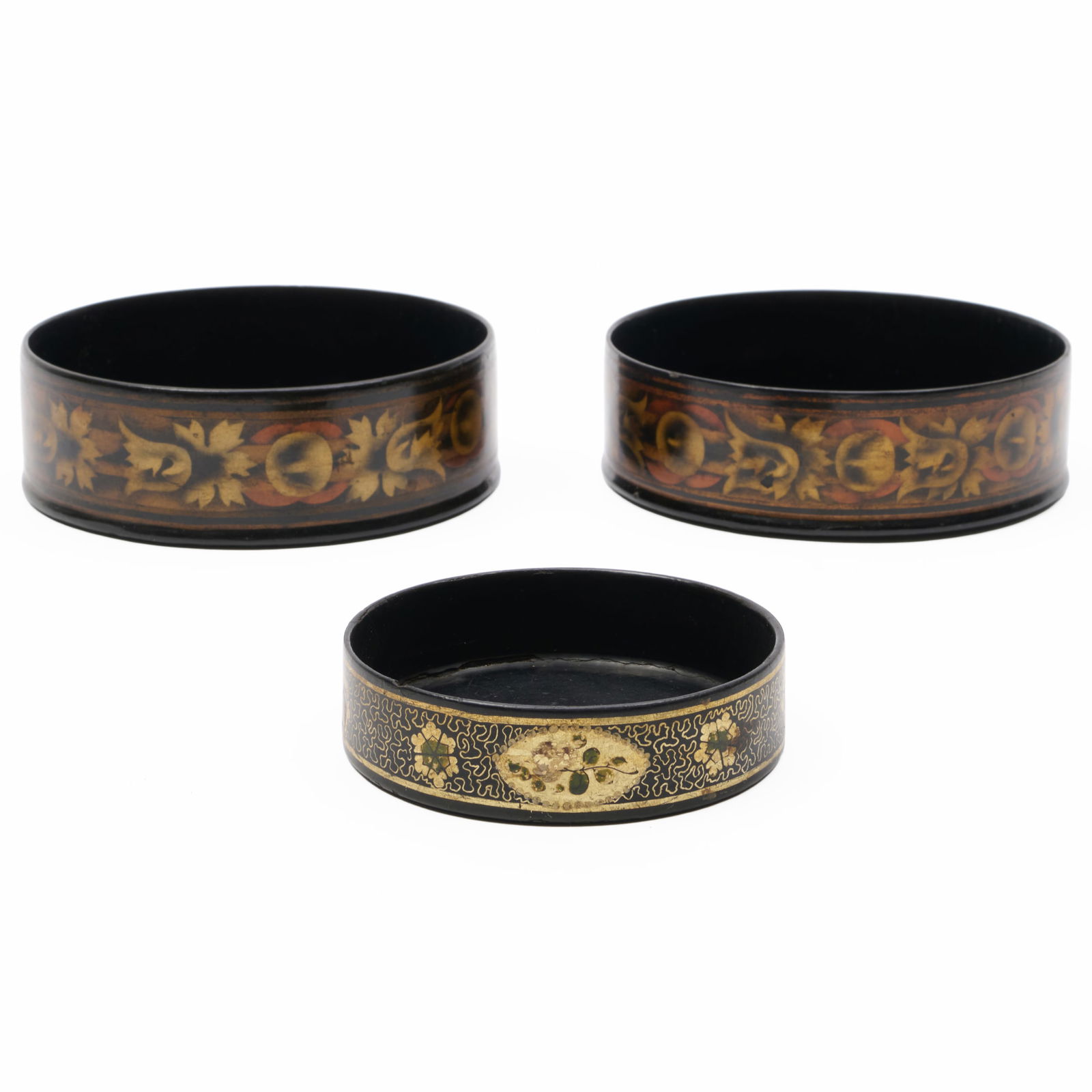 Pair of Victorian Gilt-Decorated Black Papier Mache Bottle Coasters and a Smaller Coaster: Pair of Victorian Gilt-Decorated Black Papier Mache Bottle Coasters and a Smaller Coaster The pair 1 3/4 x 5 1/2 in. diam., the smaller 1 x 4 in. diam. The Collection of James M. Labaugh Antiques, Pou