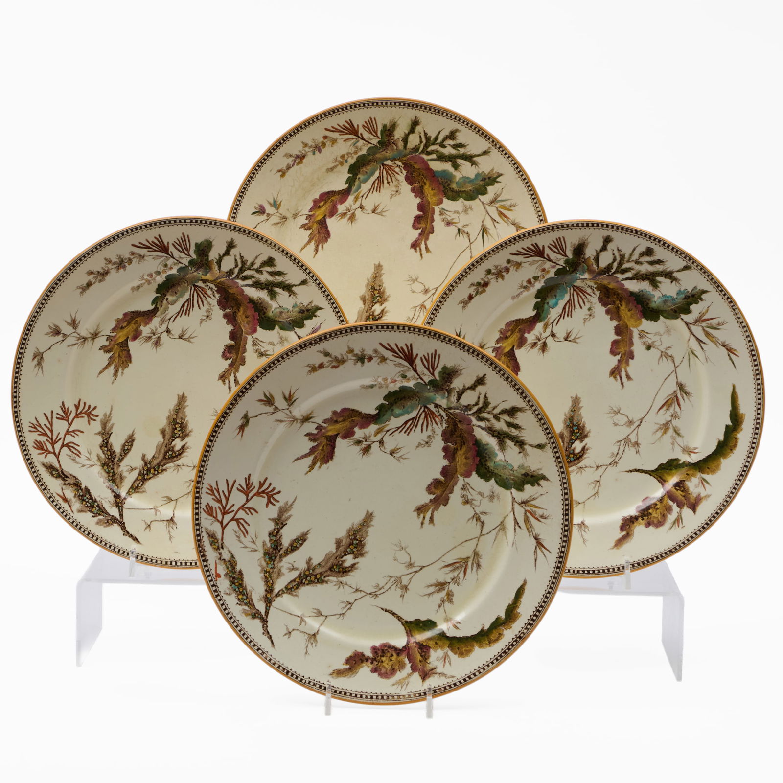 Set of Four Wedgwood Transfer Printed and Enriched Creamware Dinner Plates in a 'Seaweed' Pattern: Set of Four Wedgwood Transfer Printed and Enriched Creamware Dinner Plates in a 'Seaweed' Pattern Impressed mark. 10 in. diam.