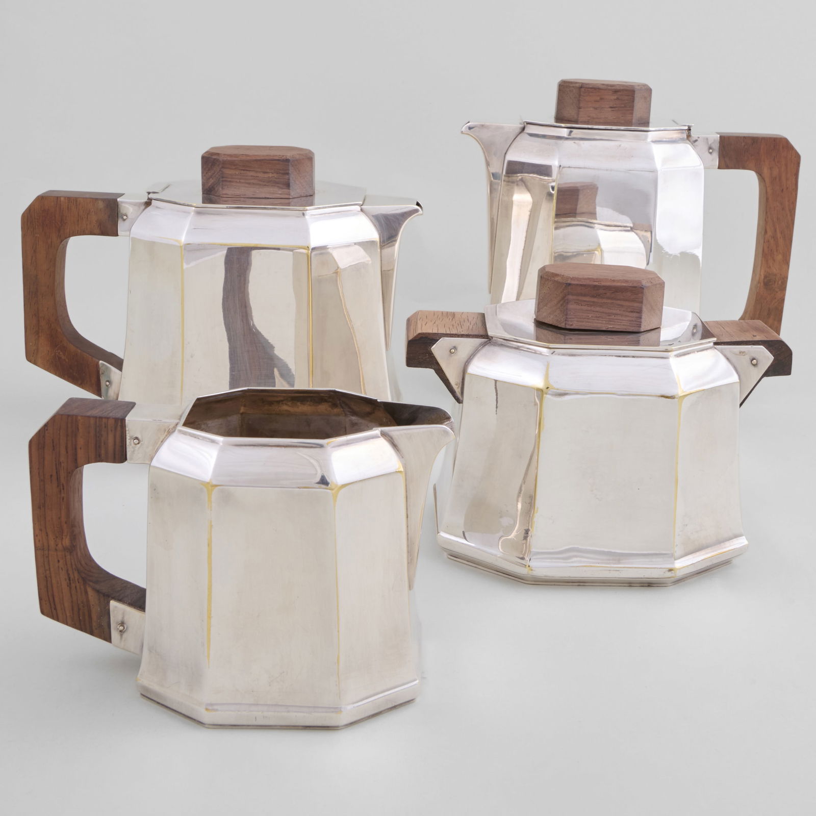 Ravinet D'Enfert Four-Piece Silver Plate Tea and Coffee Service: Ravinet D'Enfert Four-Piece Silver Plate Tea and Coffee Service Comprising: A teapot and cover A coffee pot and cover A milk jug A sugar bowl and cover The teapot 7 1/4 x 7 x 4 in. </