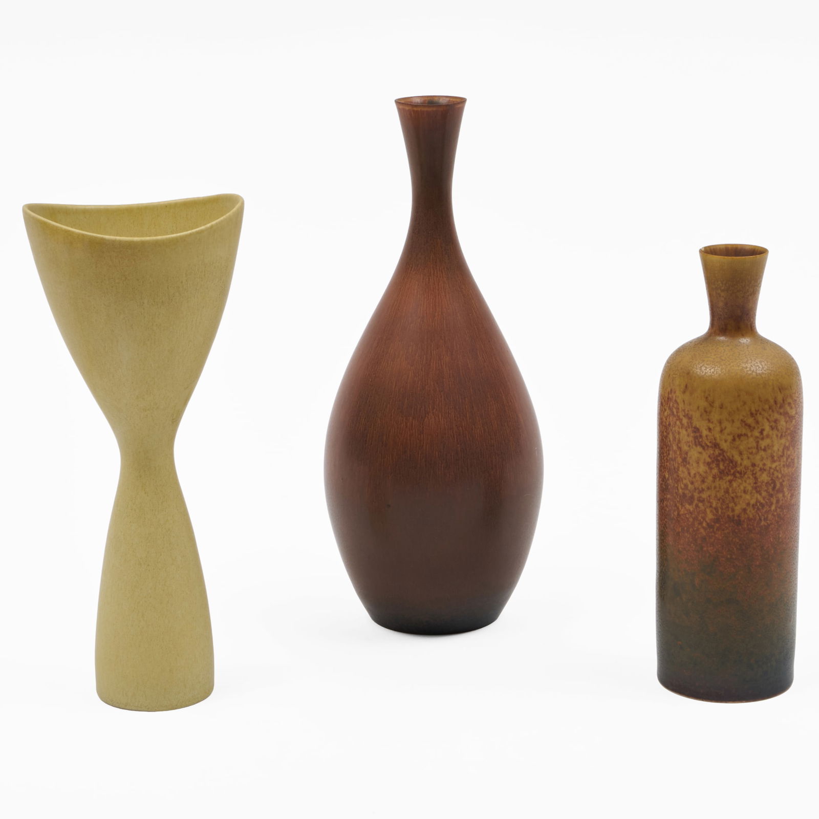 Group of Three Rorstrand Porcelain Vases: Group of Three Rorstrand Porcelain Vases Two with incised marks. Comprising: A Carl Harry Stalhane straight sided bottle vase A Carl Harry Stalhane 'Sya' bottle vase A cream everted vase, indistinct s
