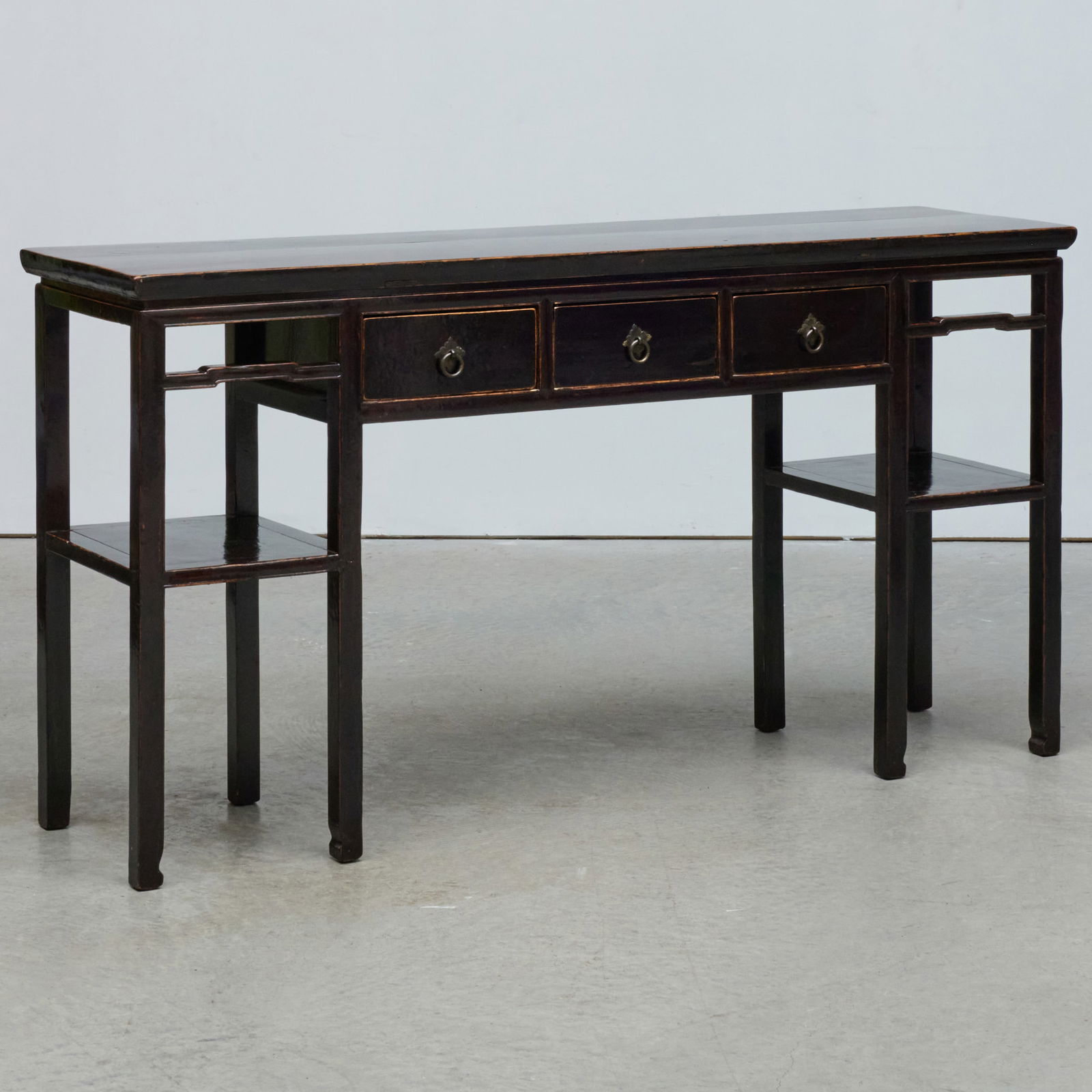 Chinese Black Painted Console Table: Chinese Black Painted Console Table 35 1/2 x 5 ft. 6 in. x 17 3/4 in. The Collection of Joel Shapiro.
