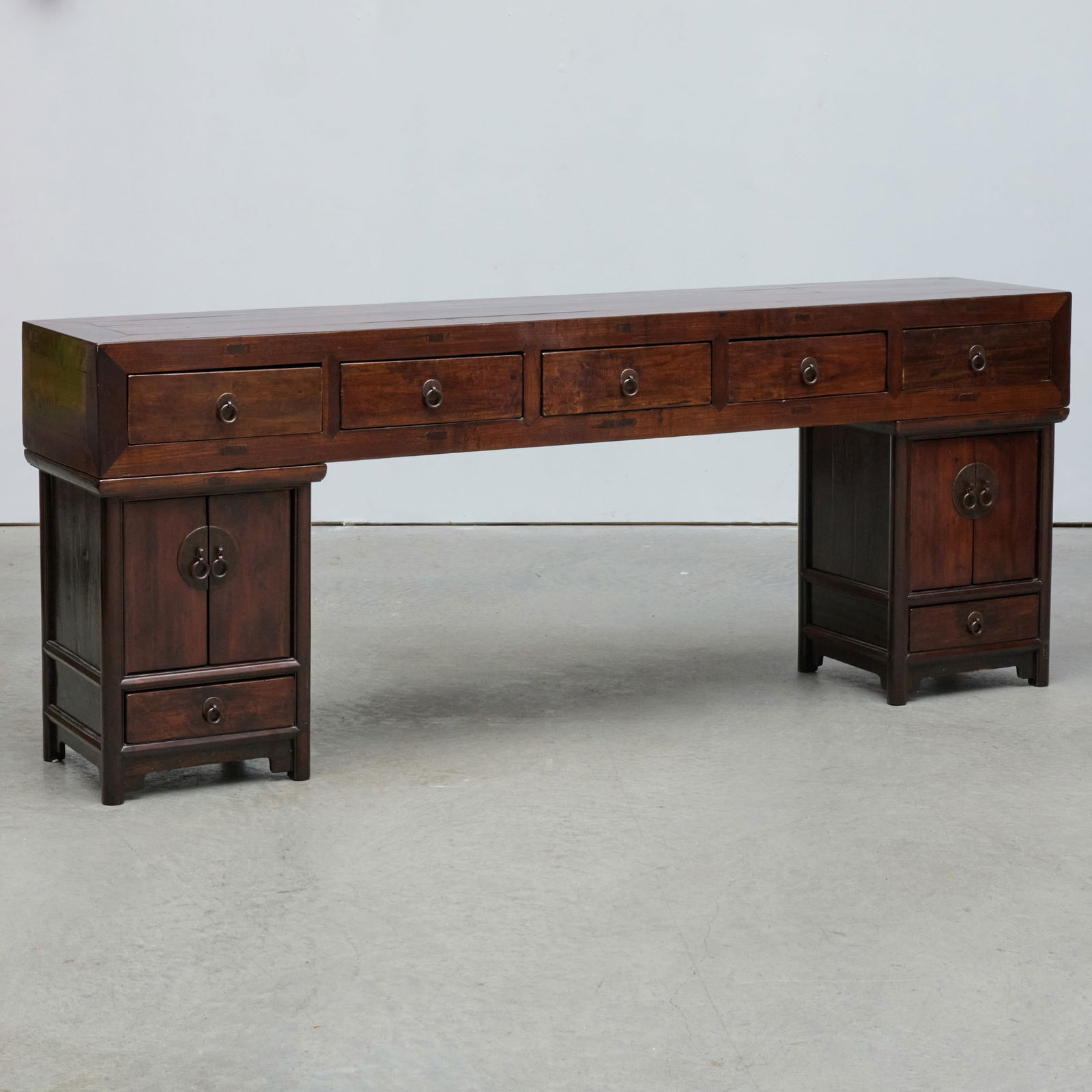 Chinese Hardwood Console Table: Chinese Hardwood Console Table In three parts. Fitted with seven drawers and two cabinets. 34 x 7 ft. 3 x 17 in. The Collection of Joel Shapiro.