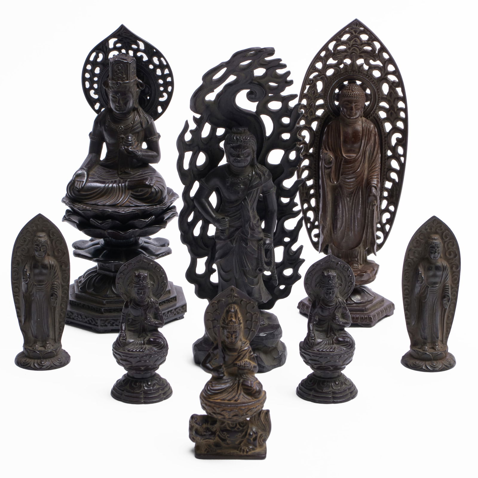 Group of Eight Japanese Patinated Metal Figures of Dieties: Group of Eight Japanese Patinated Metal Figures of Dieties The three largest with inscribed character marks. Comprising: A figure seated on lotus pad Two similar standing figures in two styles Three s