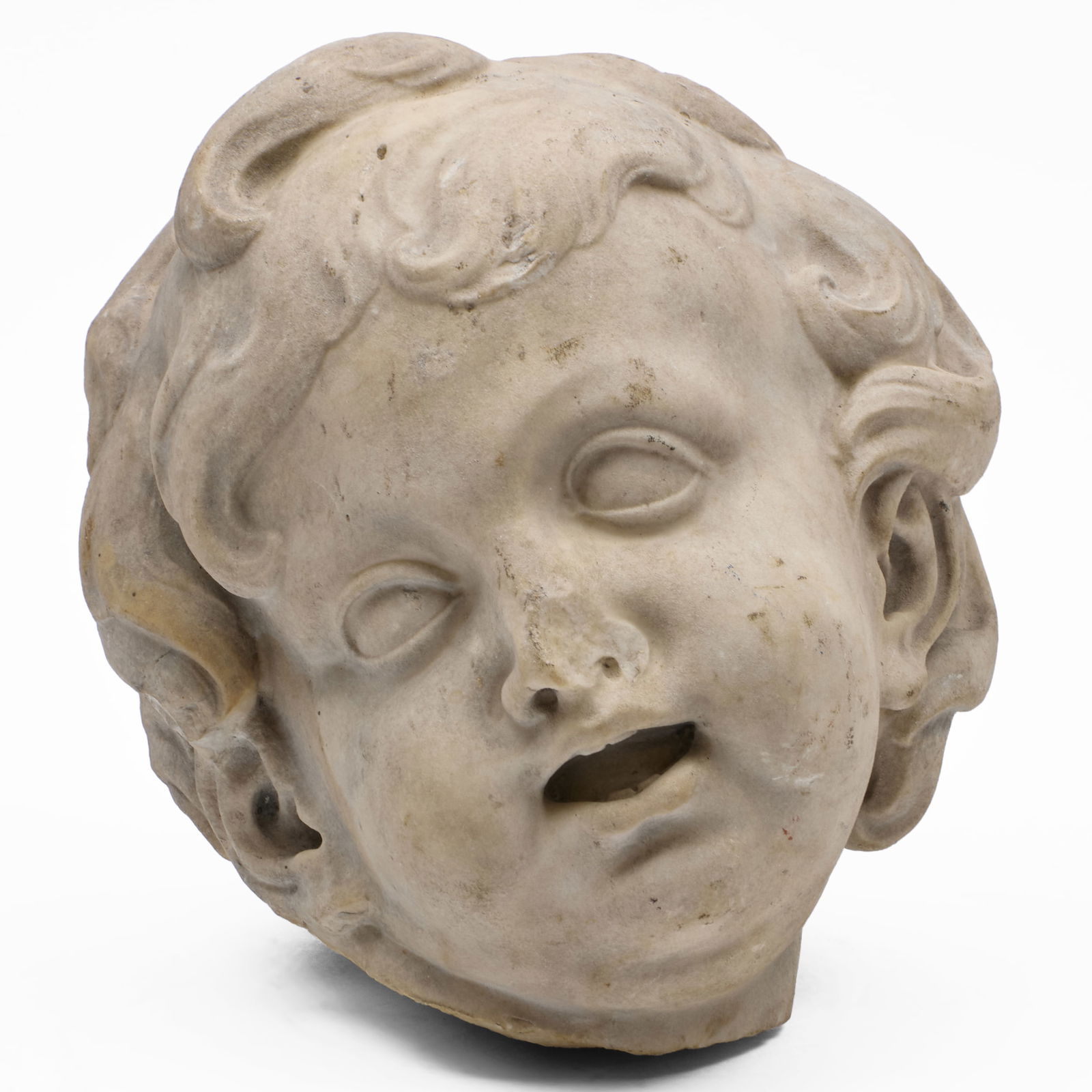 Continental Carved Stone Head of a Putto: Continental Carved Stone Head of a Putto 10 1/4 x 9 in. Sold Doyle, New York, May 19, 2010, Lot 120. Private Collection, New York.