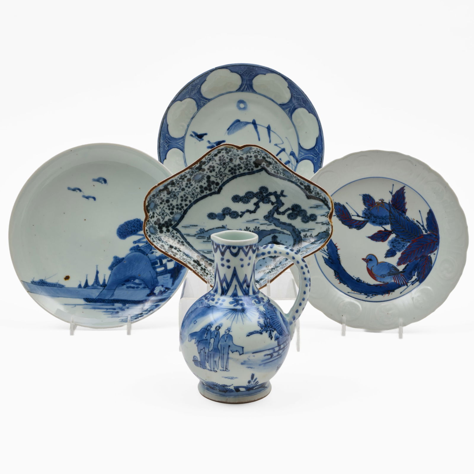 Group of Japanese Blue and White Porcelain Articles: Group of Japanese Blue and White Porcelain Articles Comprising: A lozenge shaped dish, blue painted mark A plate with river landscape, blue printed mark A plate with bird amongst branches, blue printe