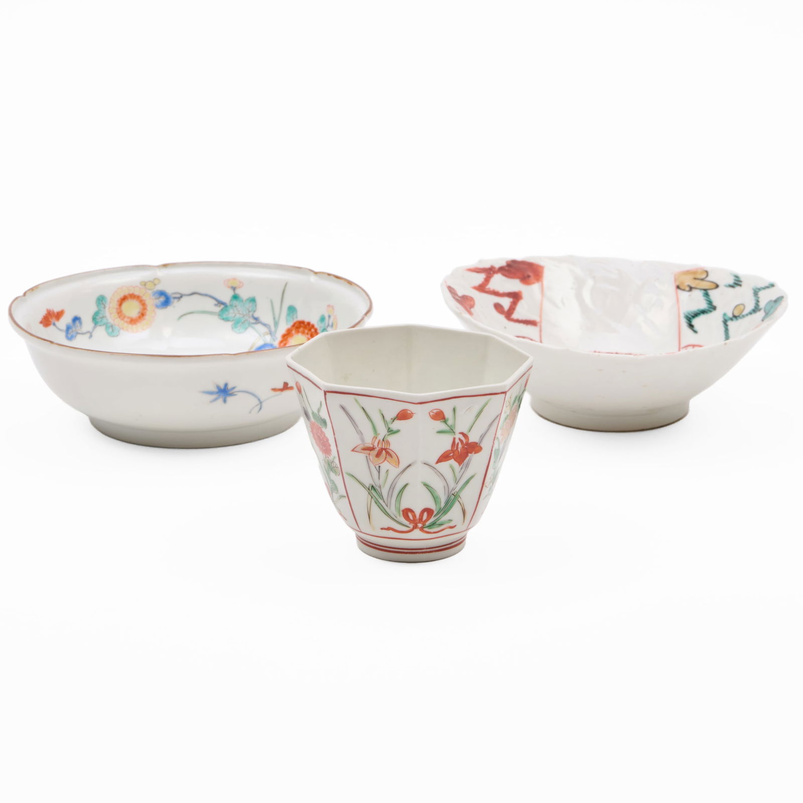 Two Japanese Kakiemon Porcelain Dishes and a Teabowl: Two Japanese Kakiemon Porcelain Dishes and a Teabowl Unmarked. Comprising: A lobed shallow dish A dish with green central medallion A faceted teabowl The largest 1 1/2 x 5 1/2 in. diam. The two dish
