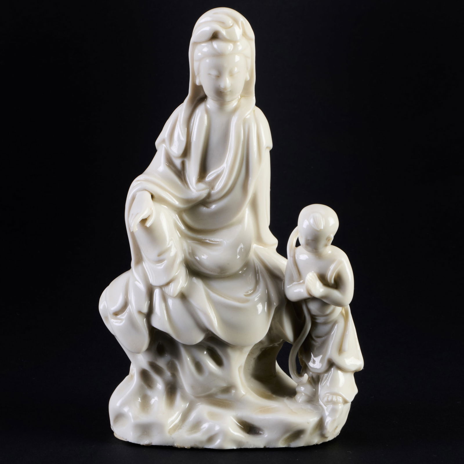 Chinese Blanc de Chine Porcelain Figure of Guanyin: Chinese Blanc de Chine Porcelain Figure of Guanyin Unmarked. 6 x 3 1/2 x 1 3/4 in. With applied label for R. & G. McPherson Antiques, London. Collection of Susan and Alan Miller, NY.