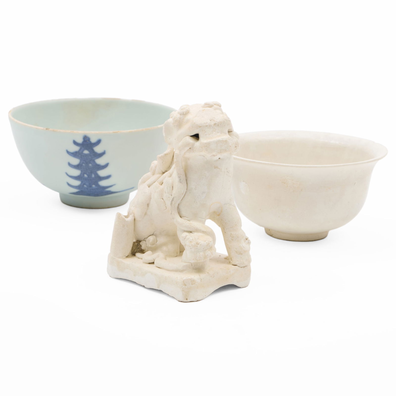 Chinese Porcelain 'Cargo' Lion Joss Stick Holder and Two Teabowls: Chinese Porcelain 'Cargo' Lion Joss Stick Holder and Two Teabowls Comprising: A Buddhistic lion form holder, unmarked A Hatcher Cargo teabowl, unmarked A San Sebastian Wreck teabowl with pagodas, blue