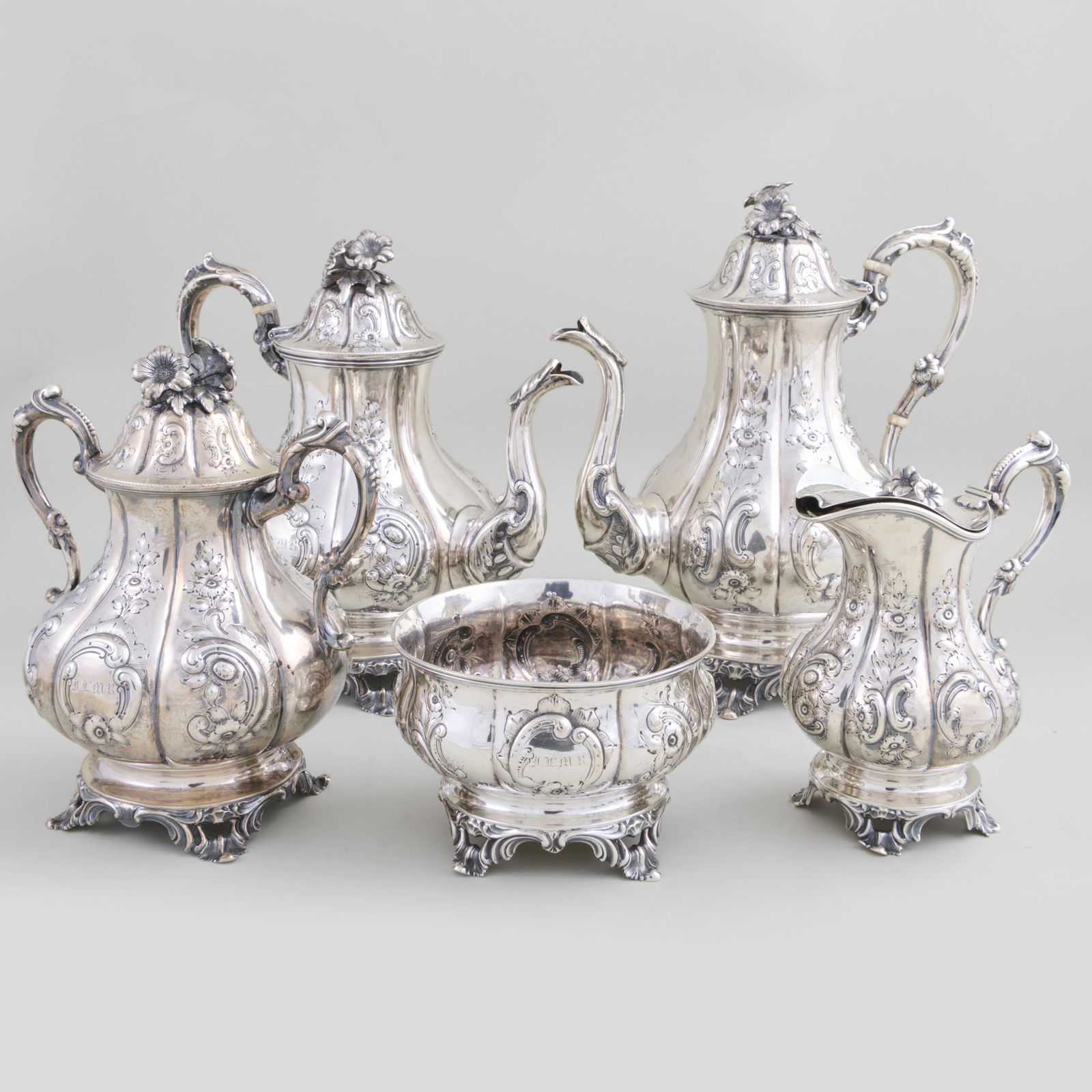 Cooper & Fisher, New York, Silver Five-Piece Tea & Coffee Service: Cooper & Fisher, New York, Silver Five-Piece Tea & Coffee ServiceMaker's mark, monogrammed.Comprising:A teapot with hinged coverA coffee pot with hinged coverA sugar bowl and coverA hot milk jug with