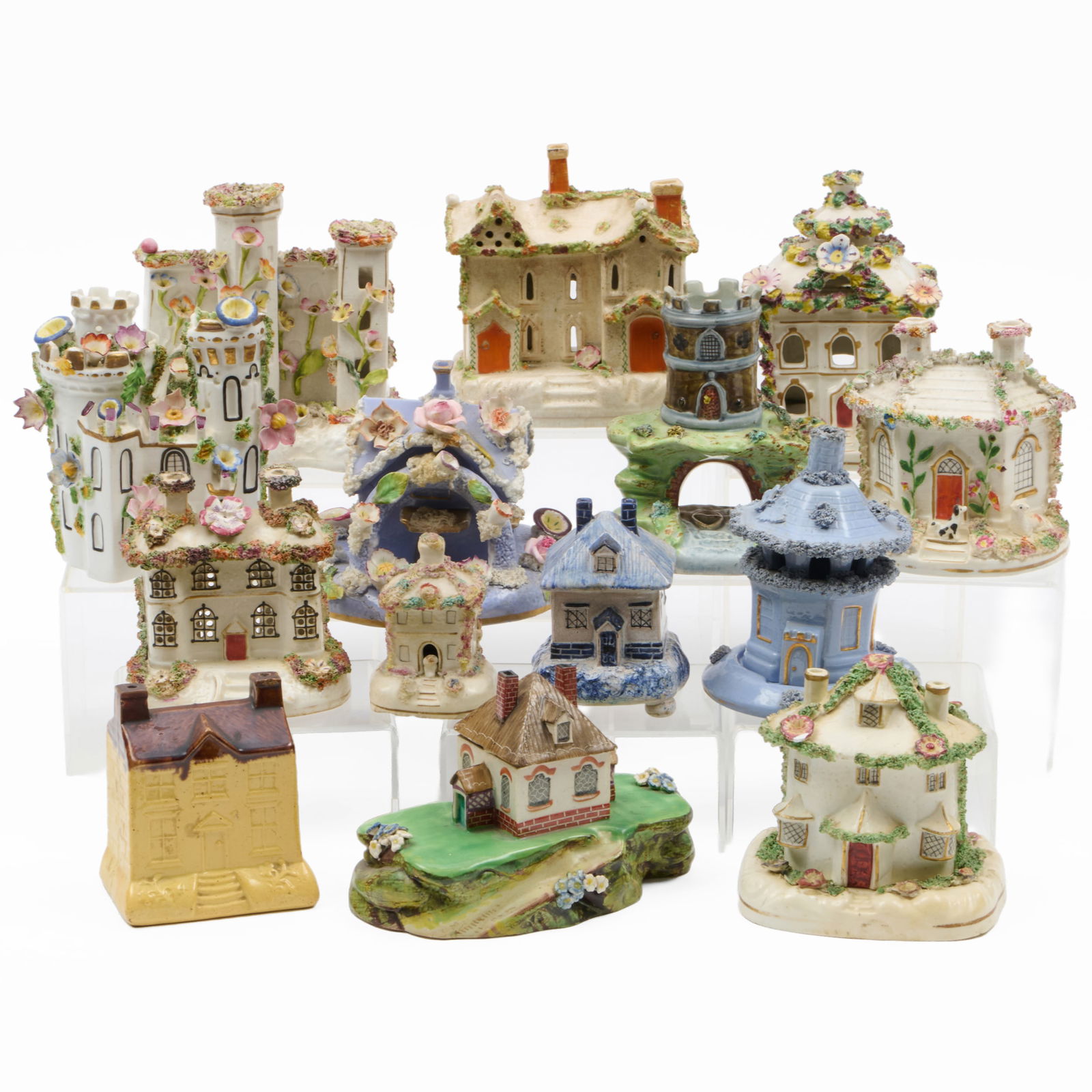 Group of Twelve Staffordshire Pastille Burners: Group of Twelve Staffordshire Pastille BurnersUnmarked.Together with:A Staffordshire model of a house with a dogAn English pottery model of a bankThe largest 5 x 7 x 4 in., (14 pcs).The Miller Family