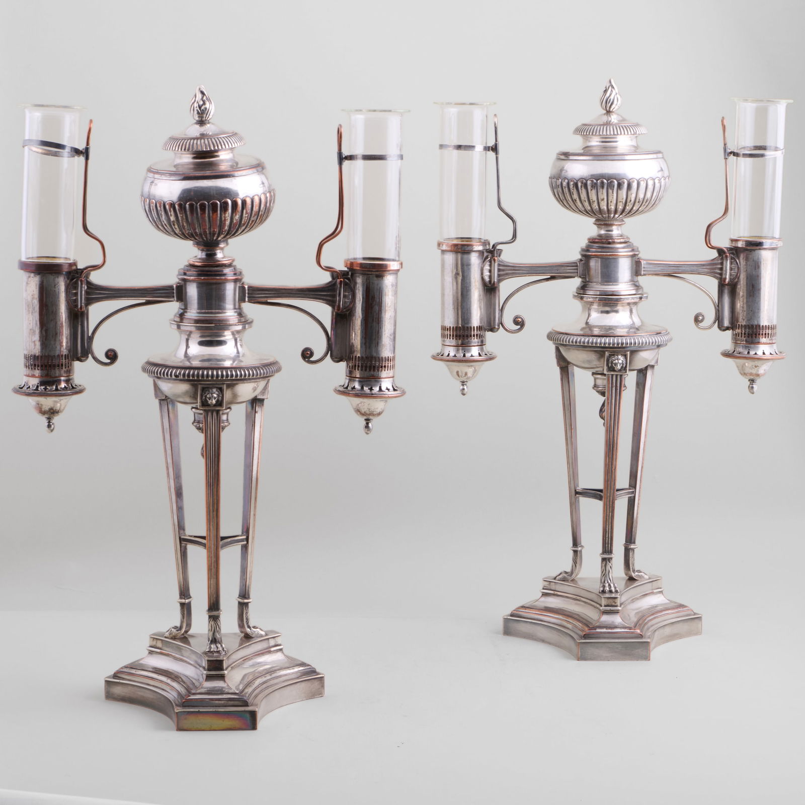 Pair of Late George III Sheffield Plate Argand Lamps, Attributed to Matthew Boulton: Pair of Late George III Sheffield Plate Argand Lamps, Attributed to Matthew BoultonTogether with four glass shades.21 x 12 1/2 x 7 1/2 in. (overall).