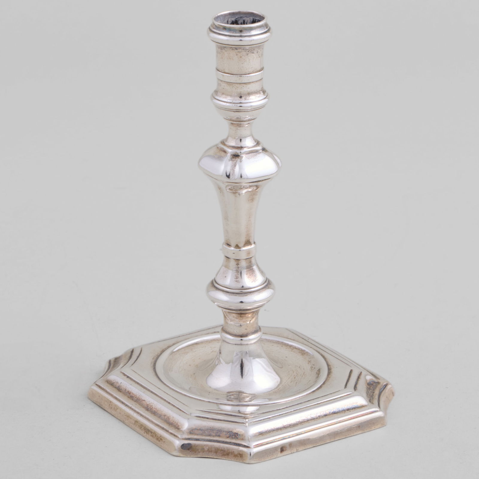 Queen Anne Silver Taperstick: Queen Anne Silver TaperstickMarked London, 1723, probably James Gould; monogrammed.4 3/8 x 2 3/4 x 2 3/4 in., 3.4 oz. approx. weight.The Vincent Dyckman Andrus Family Collection.