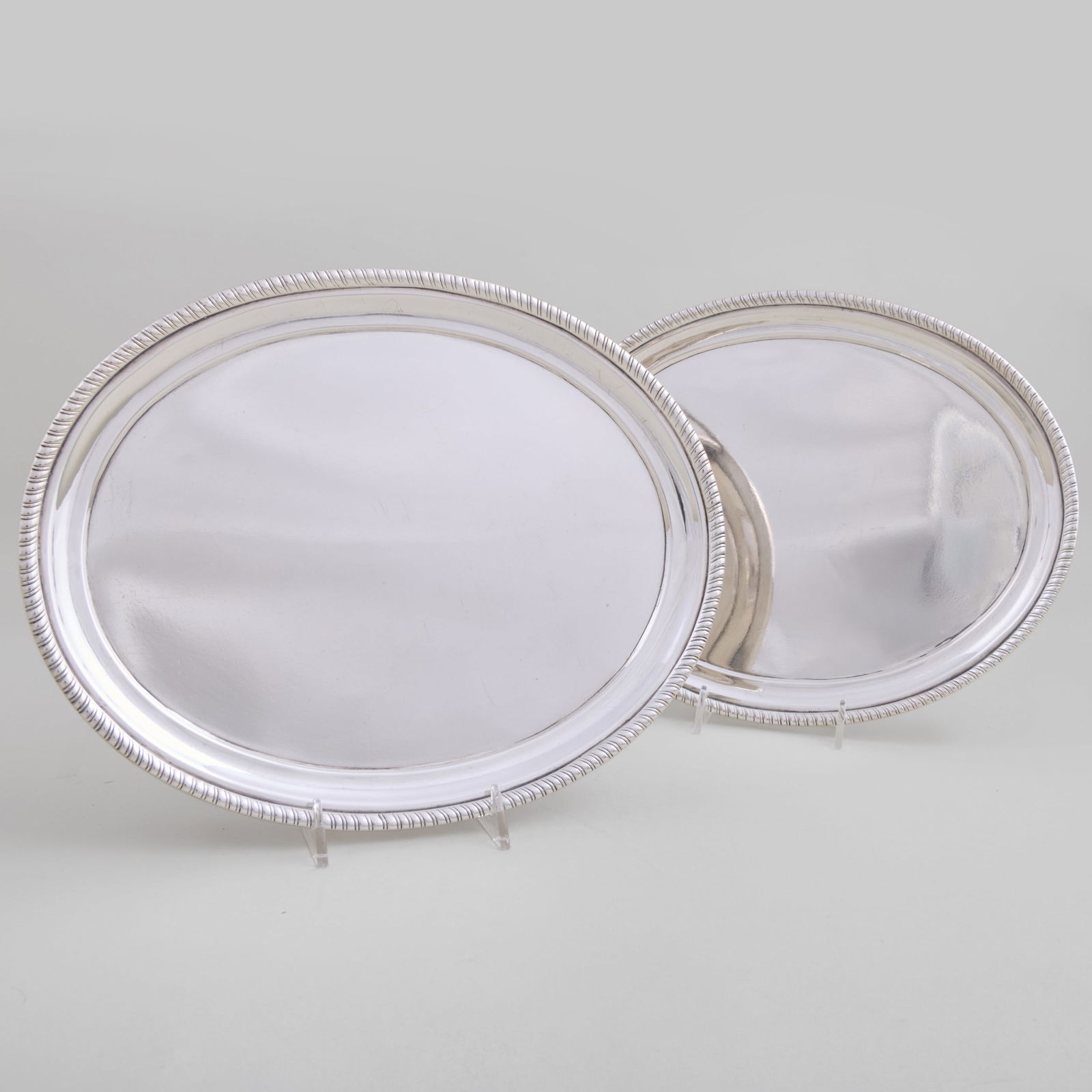 Pair of Hugh Wishart, New York, Oval Silver Salvers: Pair of Hugh Wishart, New York, Oval Silver SalversMaker's mark; inscribed 'S. Richard Fecit'.1 3/8 x 8 1/4 x 10 3/8 in., 42.3 oz. approx. weight.The Vincent Dyckman Andrus Family Collection.