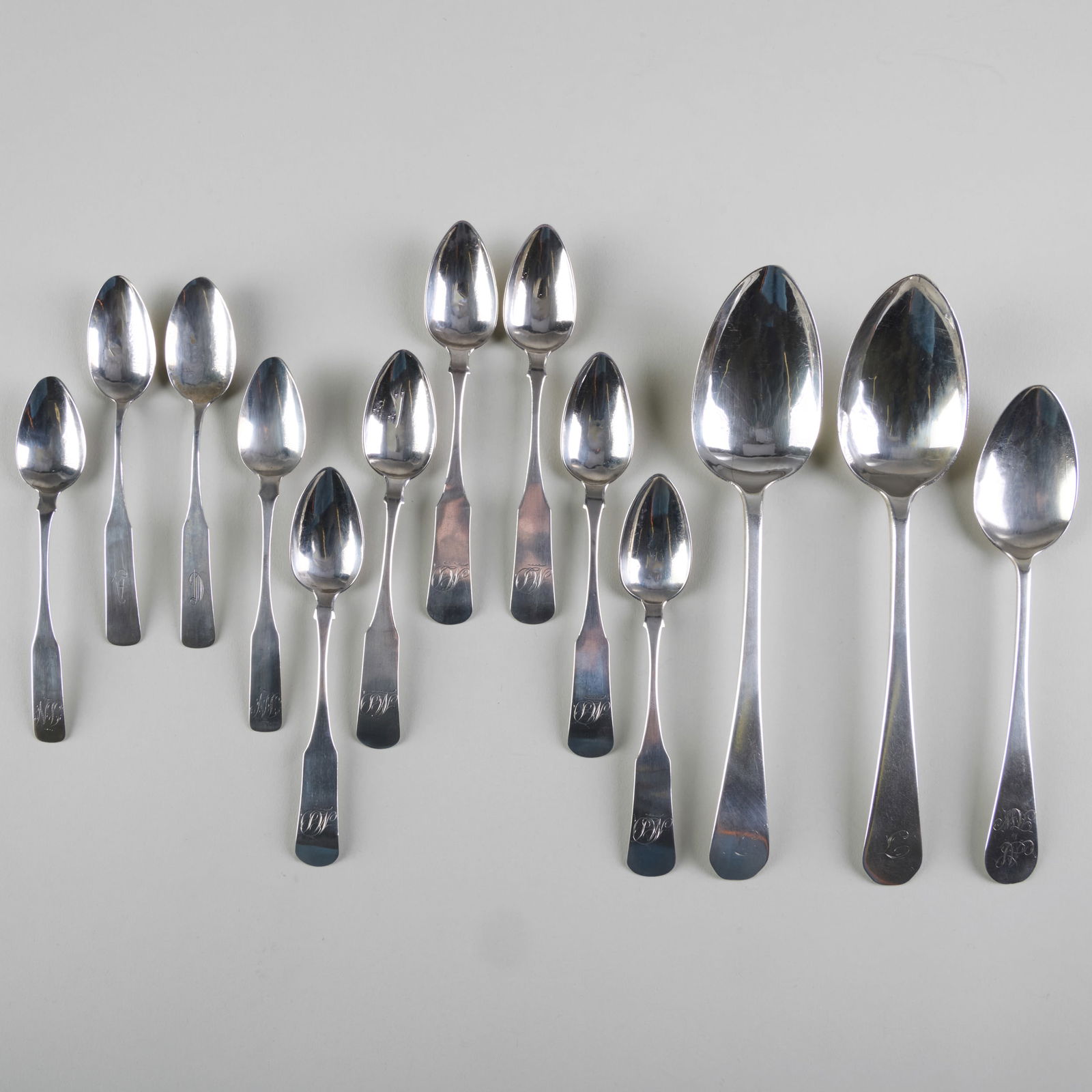 Group of William Moulton and Joseph Moulton Silver Spoons: Group of William Moulton and Joseph Moulton Silver SpoonsEach monogrammed, variously marked.Comprising:Two large tablespoonsA tablespoonA set of six teaspoonsA pair of teaspoonsA pair of teaspoonsThe