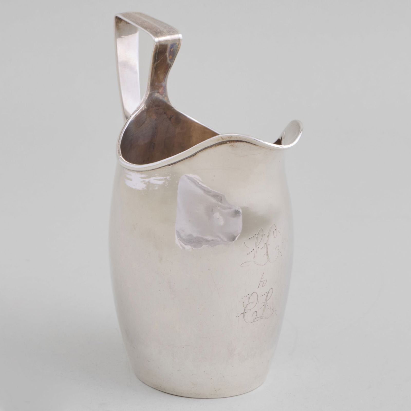 William Moulton IV, Newburyport, MA, Silver Cream Jug: William Moulton IV, Newburyport, MA, Silver Cream Jug Maker's mark, ca 1805, monogrammed and inscribed. 5 x 4 x 2 1/2 in., 3.9 oz. approx. weight. The Vincent Dyckman Andrus Family Collection.