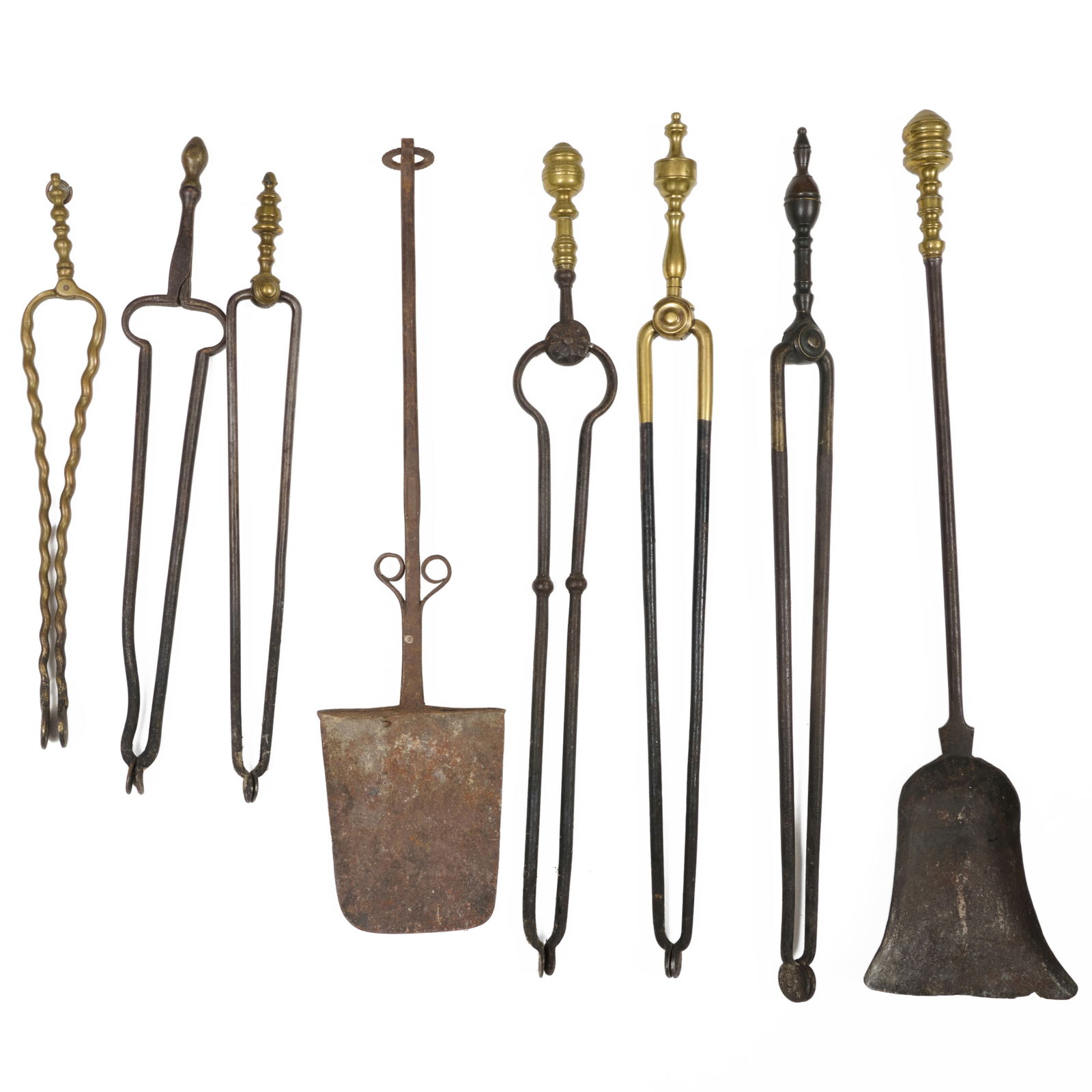Miscellaneous Group of Fireplace Tools, and Two Brass Fire Fenders: Miscellaneous Group of Fireplace Tools, and Two Brass Fire Fenders Comprising: Eight Fire Tools Two Fire Fenders, 9 1/4 x 44 x 10 3/4 in., the largest. Collection of Beverly & Richard Kelly.