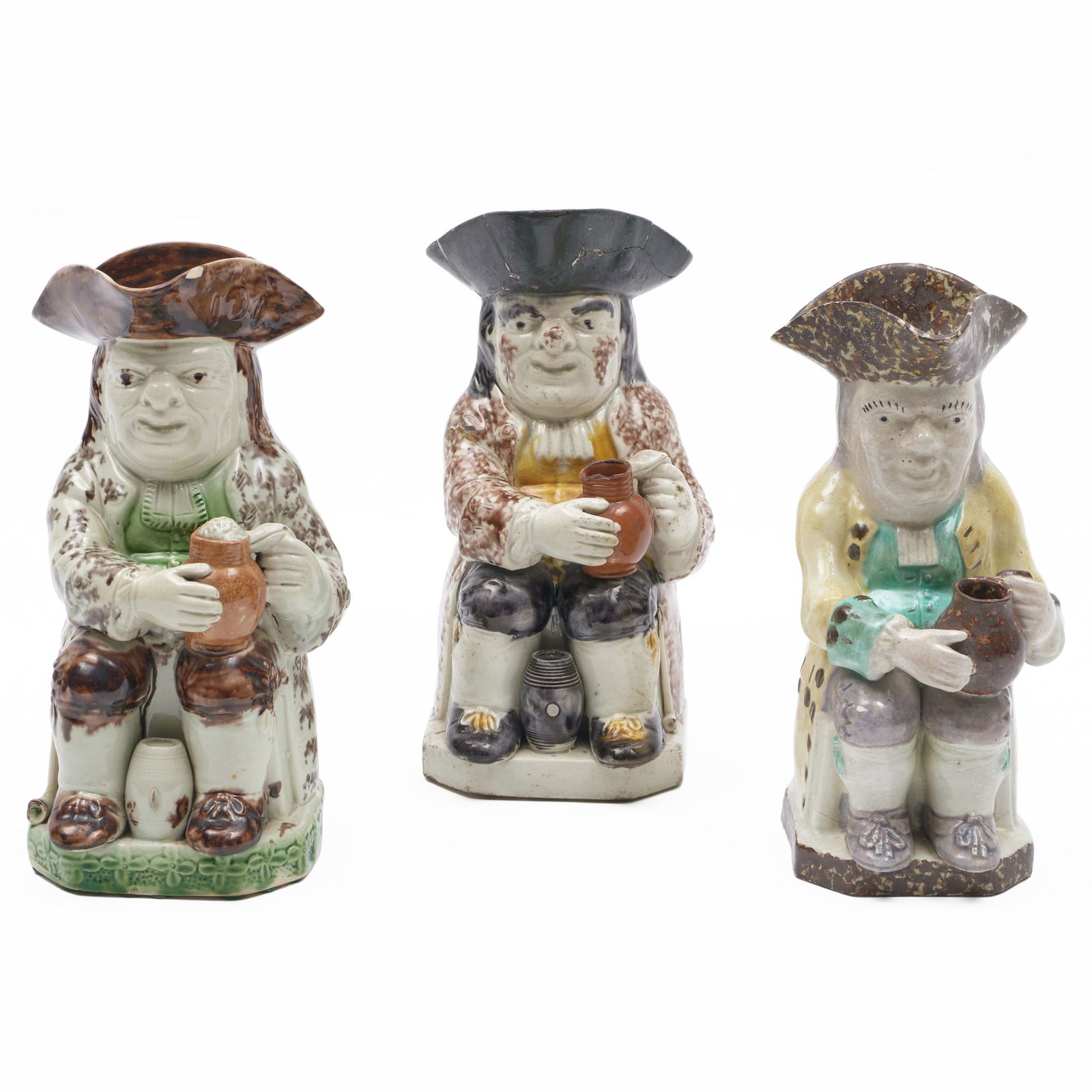 Three Staffordshire Toby Jugs: Three Staffordshire Toby JugsUnmarked.The largest 10 x 7 x 4 1/2 in.Ex-collection Electra Havemeyer Webb.Property from Mr. and Mrs. Dunbar W. Bostwick of Shelburne, VT, New York, NY, and Aiken, SC,