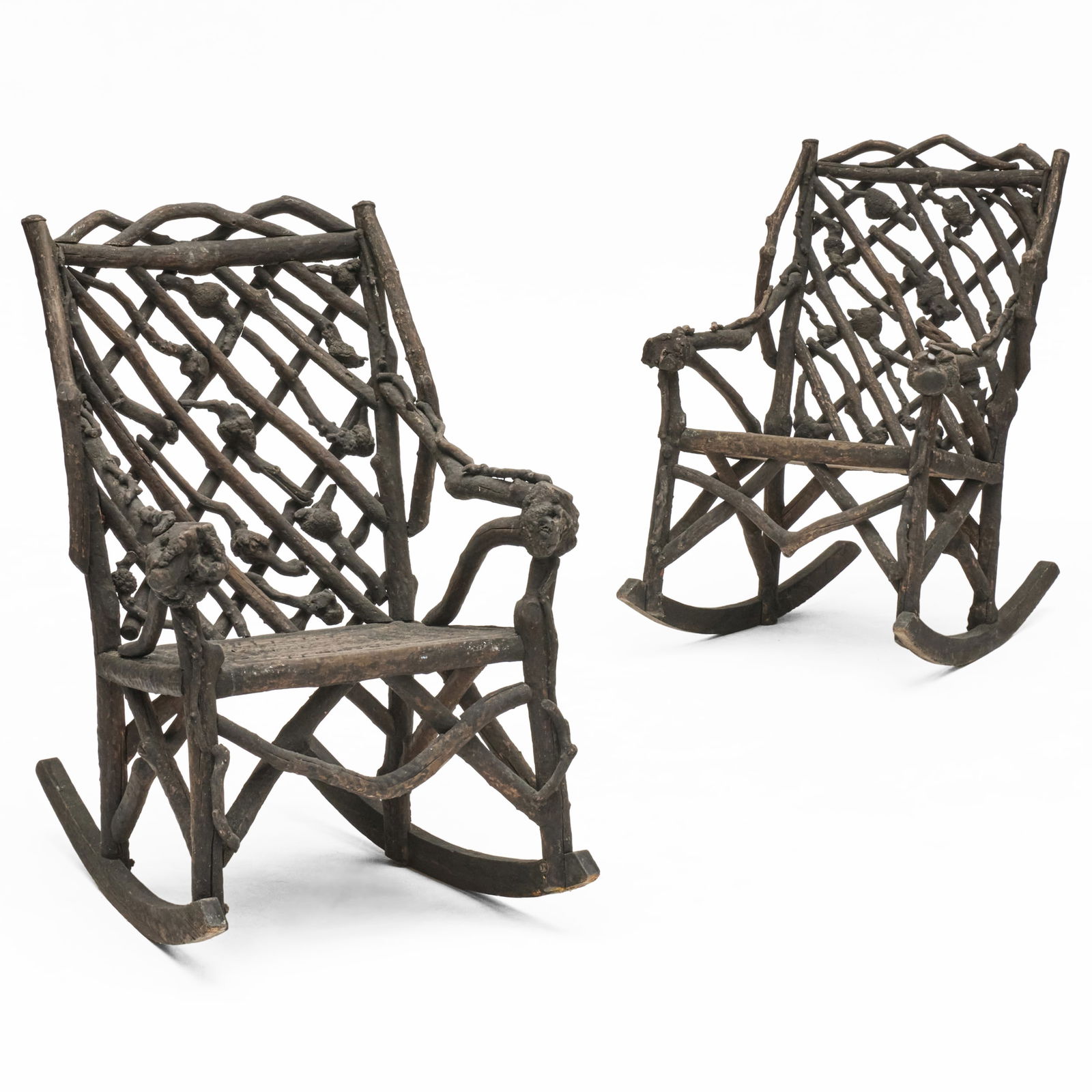 Pair of Adirondack Painted Twig Rockers: Pair of Adirondack Painted Twig Rockers40 x 26 1/2 x 35 1/2 in., seat height 18 in., and39 1/2 x 26 3/4 x 35 1/4 in., seat height 18 in.The Collection of Joel Shapiro.
