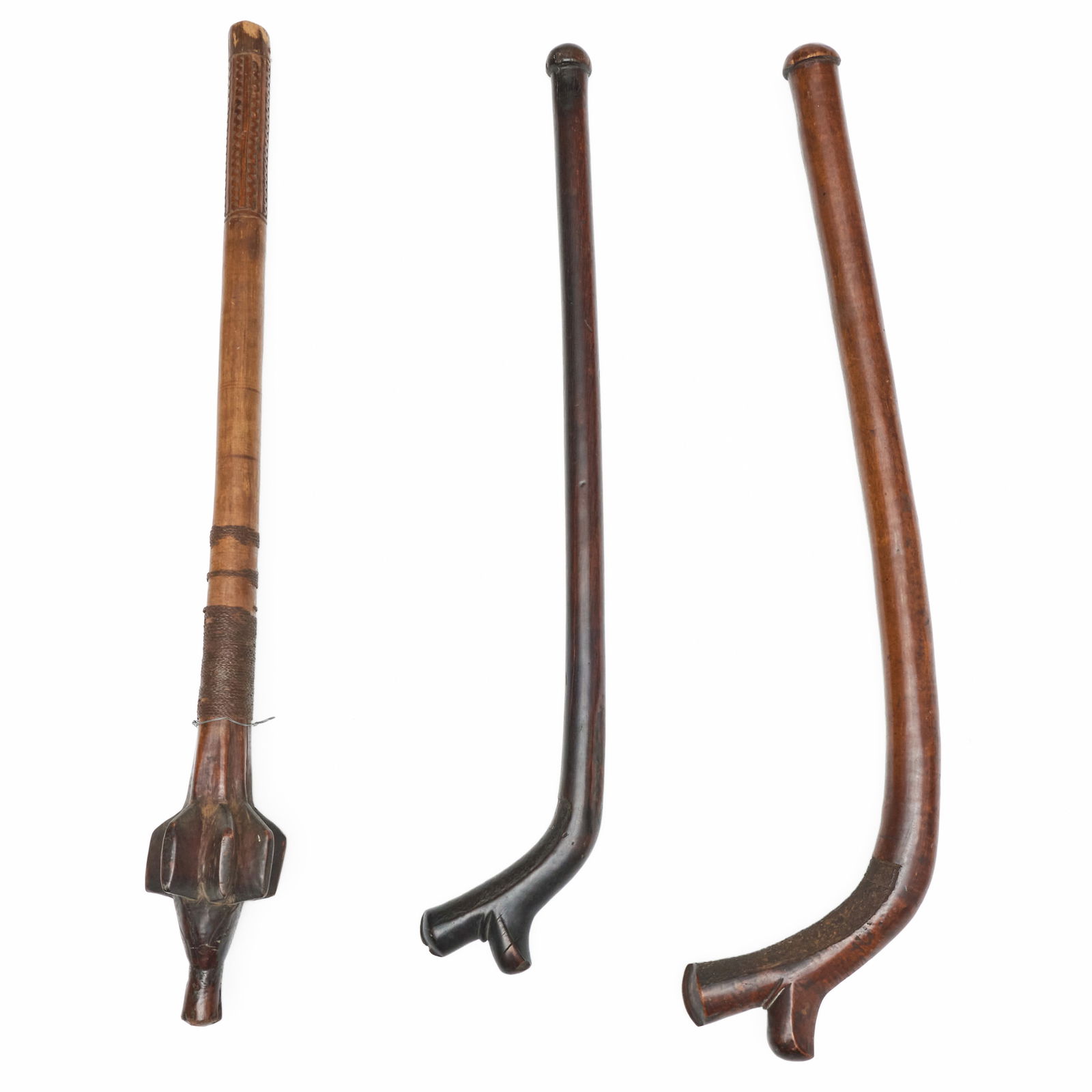 Group of Three Carved War Clubs: Group of Three Carved War ClubsThe largest 41 x 11 in. 
