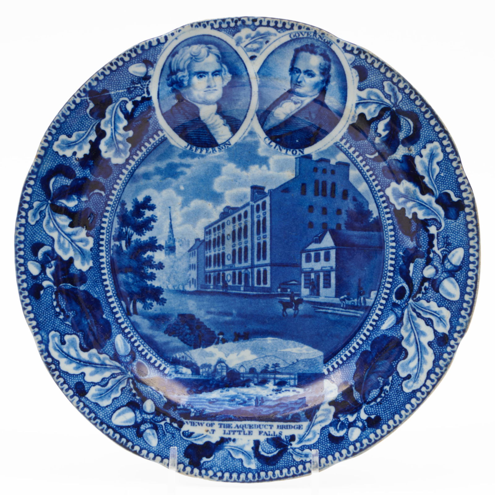 Stevenson and Williams Staffordshire Plate with 'Jefferson and Clinton above City Hotel, NY' with: Stevenson and Williams Staffordshire Plate with 'Jefferson and Clinton above City Hotel, NY' with inset 'View of the Aqueduct Bridge at Little Falls' Impressed mark. 8 1/2 in. diam. The Miller Family