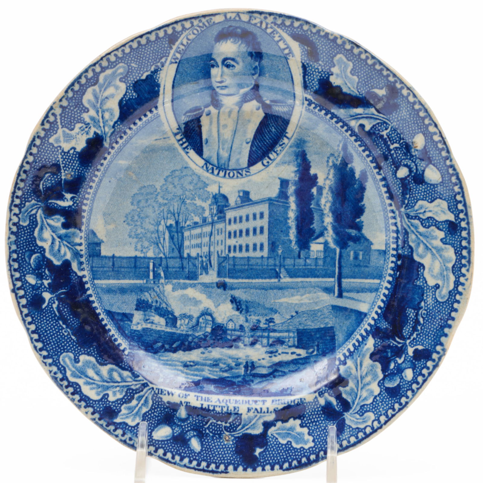 Stevenson and Williams Staffordshire Plate with 'Lafayette above Columbia College' with inset 'View: Stevenson and Williams Staffordshire Plate with 'Lafayette above Columbia College' with inset 'View of the Aqueduct Bridge at Little Falls'Partial impressed mark.6 1/2 in. diam.The Miller Family