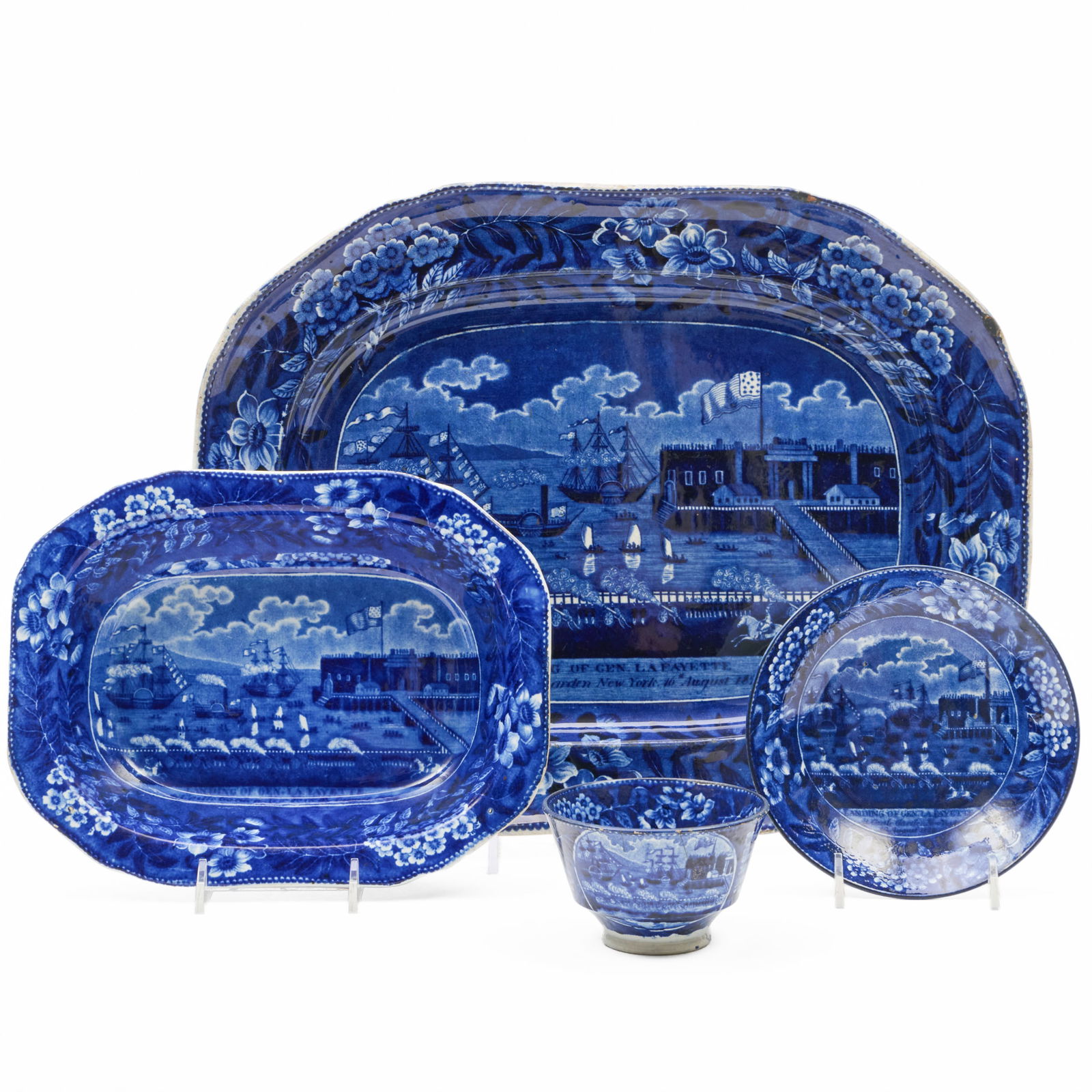 Group of Clews Staffordshire 'Landing of General Lafayette at Castle Gardens, NY' Wares: Group of Clews Staffordshire 'Landing of General Lafayette at Castle Gardens, NY' WaresThe platter, saucer and vegetable dish with impressed mark.Comprising:A platter A vegetable dishA teabowl and