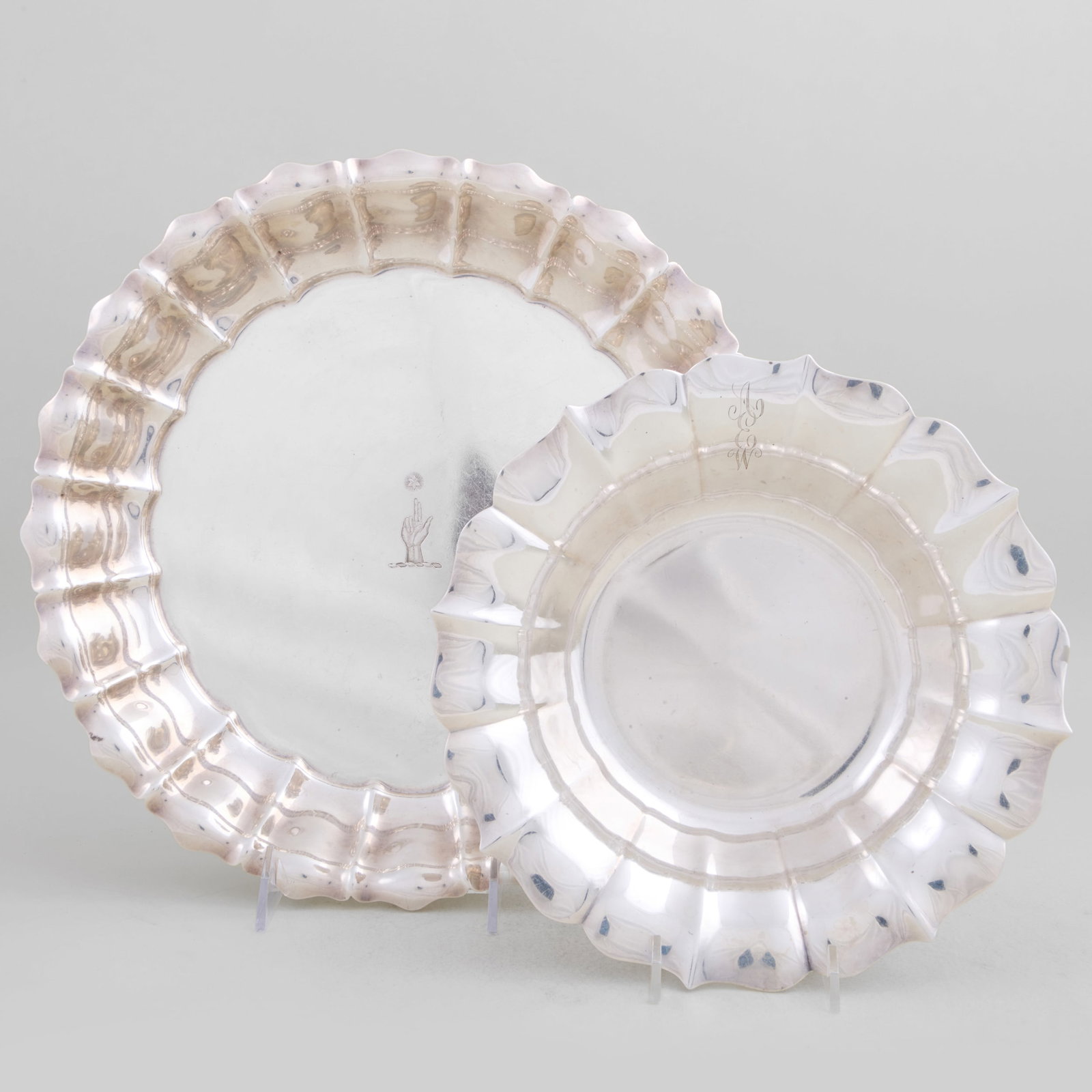 Gorham Silver Dish and a Wallace Silver Dish: Gorham Silver Dish and a Wallace Silver Dish Marked 'Sterling', the larger engraved with crest. The larger 1 3/4 x 13 in. diam., the smaller 2 x 9 1/2 in. diam., 47.4 oz. approx. weight. The Miller Fa