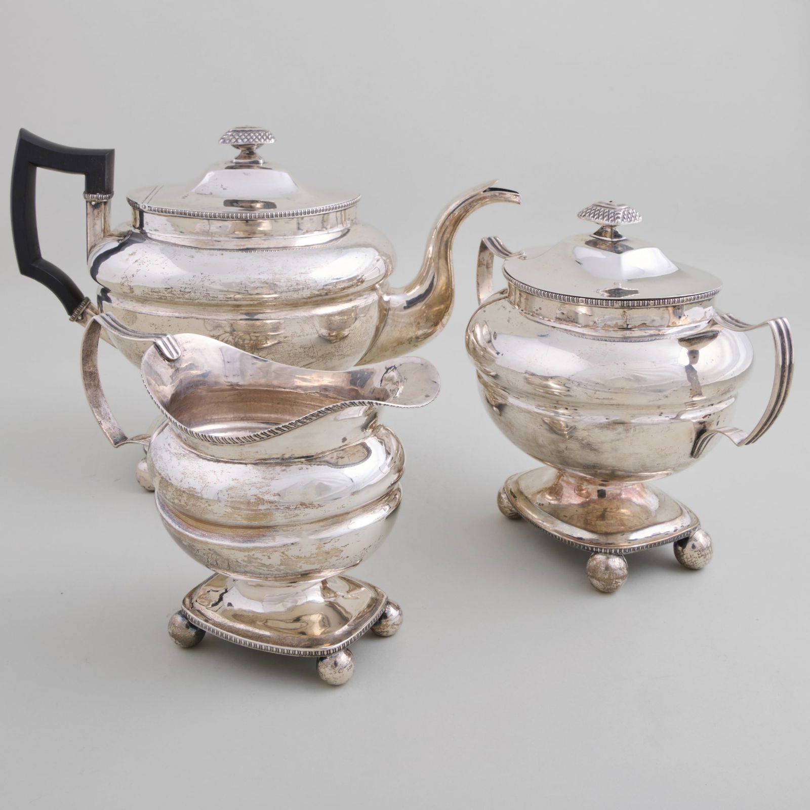 Charles Aldis and Garett Eoff, New York, Silver Three-Piece Tea Service: Charles Aldis and Garett Eoff, New York, Silver Three-Piece Tea Service Maker's marks, monogrammed. Comprising: A teapot with hinged cover A sugar bowl and cover A milk jug The teapot 8 1/4 x 12 x 5 1