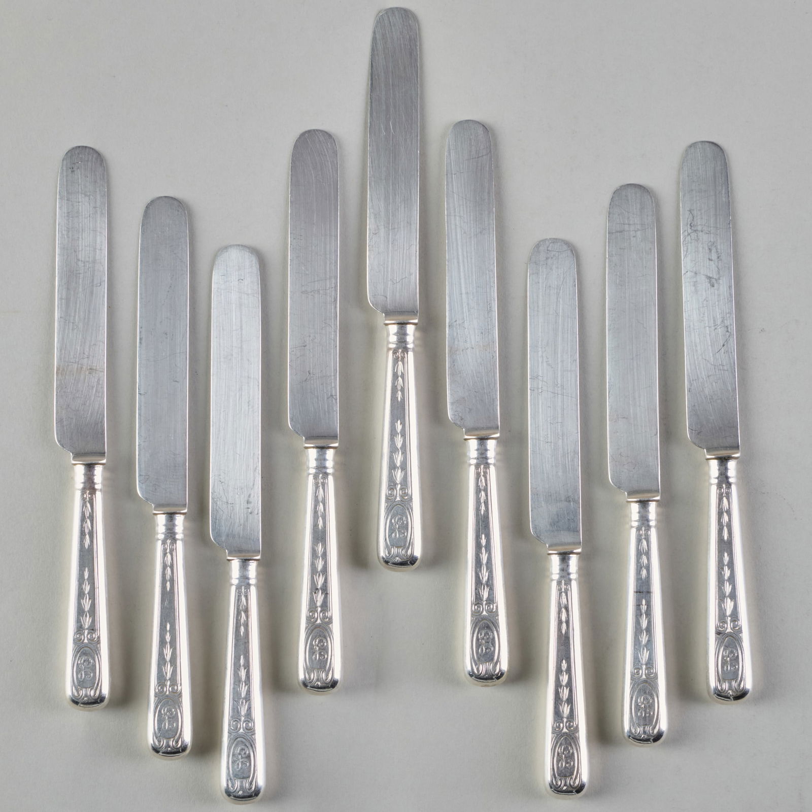 A set of Nine Albert Cole and Gorham Silver Fruit Knives: A set of Nine Albert Cole and Gorham Silver Fruit Knives Maker's mark, monogrammed, with filled handles. 7 1/4 in. long.