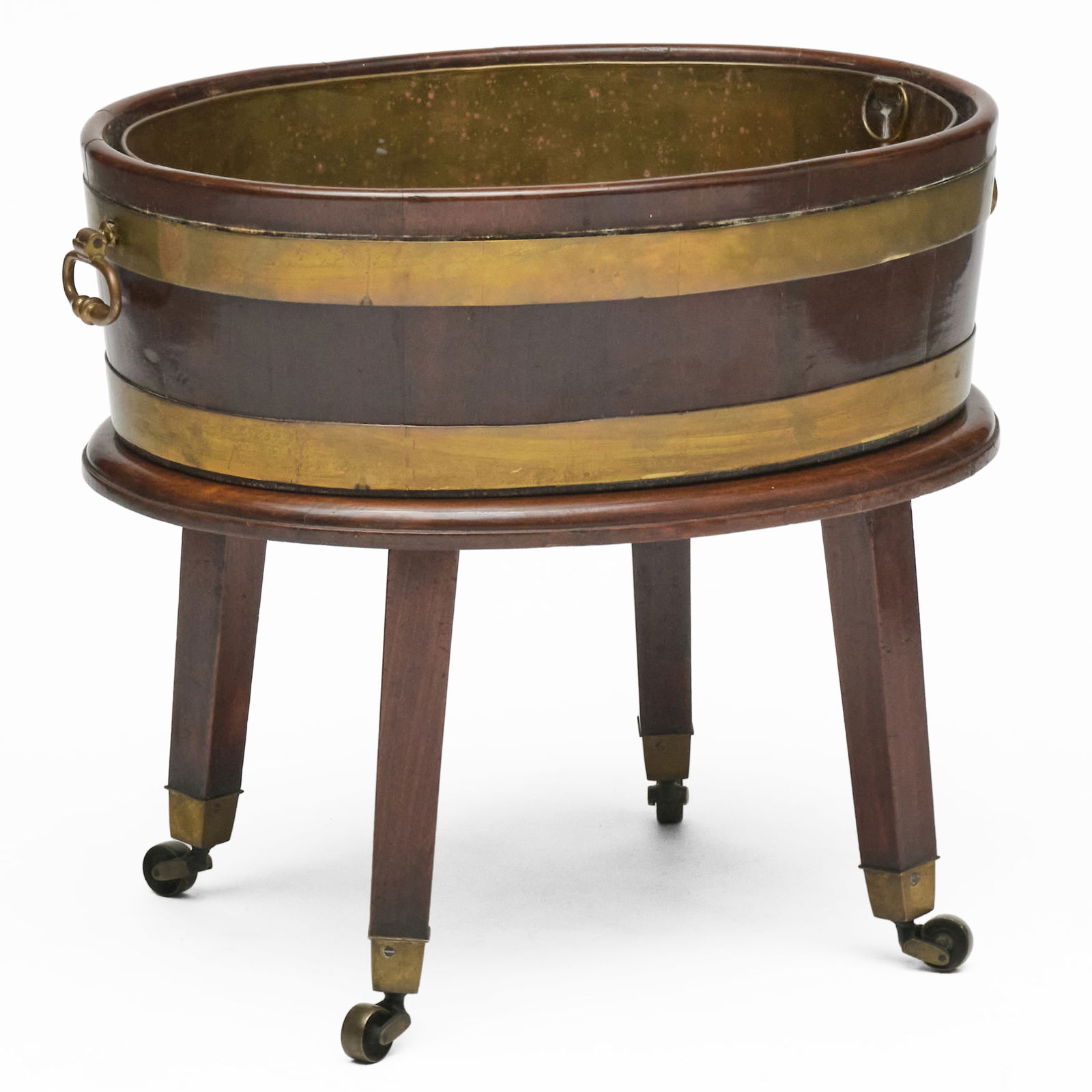 George III Brass-Bound Oval Wine Cooler on Later Stand: George III Brass-Bound Oval Wine Cooler on Later Stand Raised on casters.? 22 x 25 1/2 x 19 in. Property from the Collection of a Prominent Long Island Family.