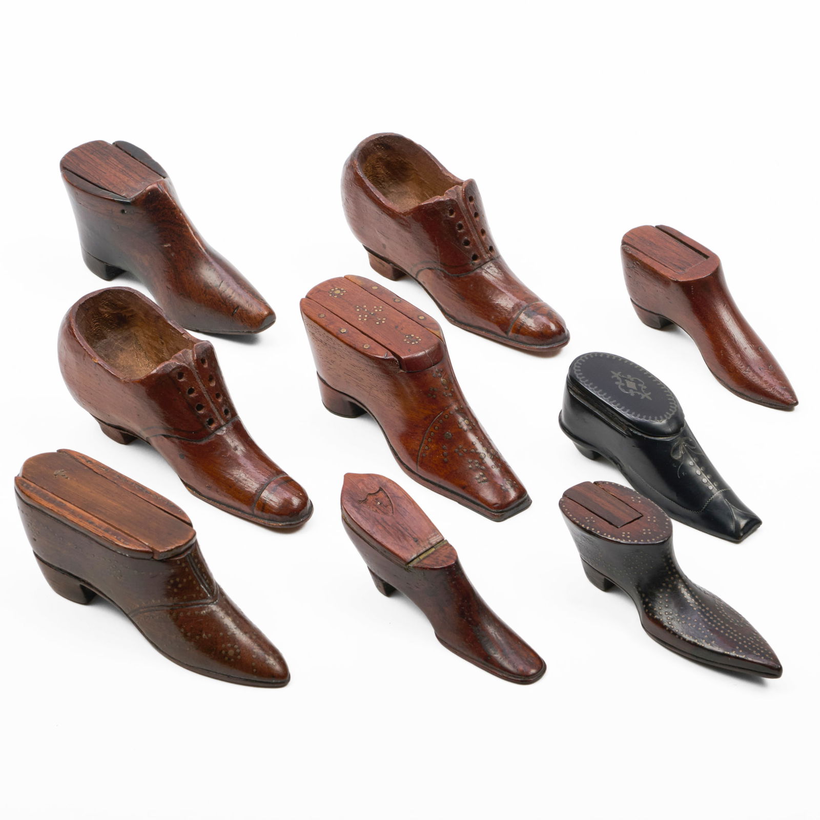 Group of English Treen Shoe and Boot-Form Snuffboxes: Group of English Treen Shoe and Boot-Form SnuffboxesThe largest 1 3/4 x 4 x 1 1/4 in.The smallest 1 1/2 x 3 1/4 x 3 /4 in.Property from the Collection of a Prominent Long Island Family.