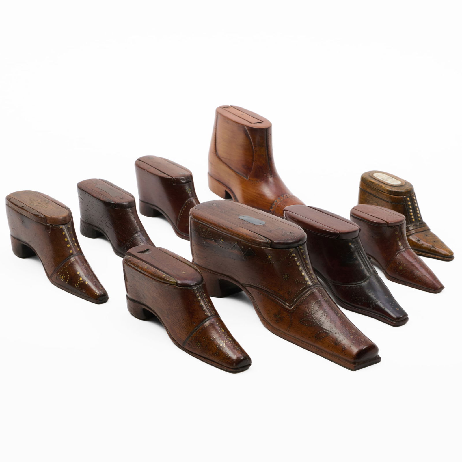 Group of English Treen Shoe and Boot-Form Snuffboxes: Group of English Treen Shoe and Boot-Form Snuffboxes The largest 2 1/4 x 7 x 1 3/4 in. The smallest 1 1/2 x 3 1/4 x 1 1/4 in. Property from the Collection of a Prominent Long Island Family.