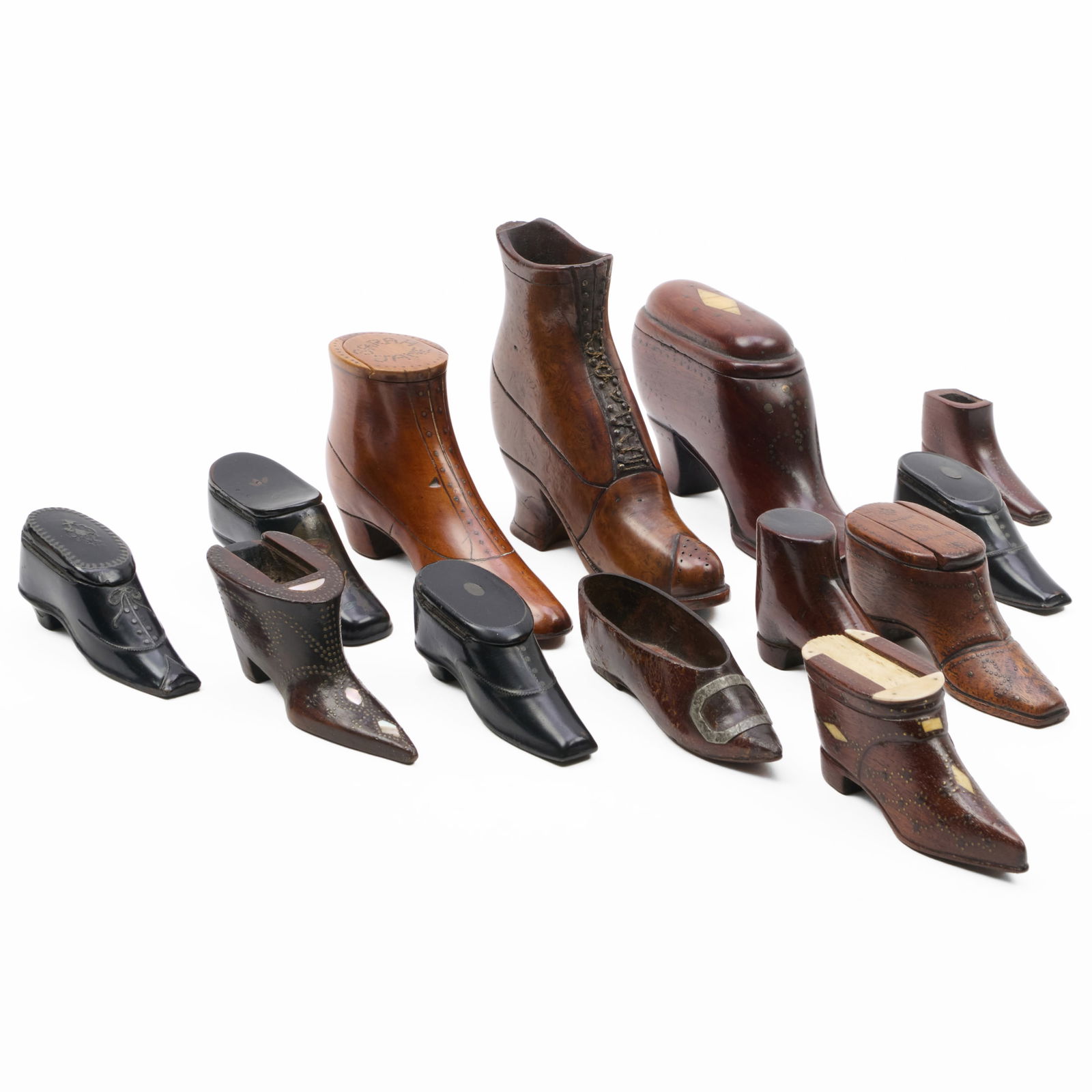 Group of English Treen Shoe and Boot-Form Snuffboxes: Group of English Treen Shoe and Boot-Form Snuffboxes The largest 4 x 5 x 1 1/4 in.? The smallest 1 1/4 x 2 1/2 x 3/4 in. Max Webber, Inc., Middleton, MA, 1977 ($4,000).Property from the Collection of