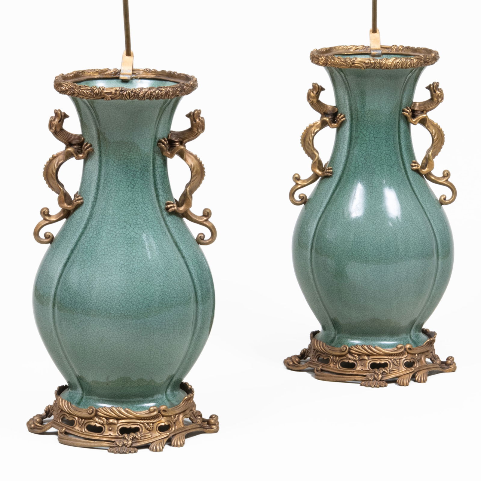 Pair of Large Gilt-Metal-Mounted Celadon Glazed Vases Mounted as Lamps: Pair of Large Gilt-Metal-Mounted Celadon Glazed Vases Mounted as Lamps The vases?24 1/2?x 12 x 9 in., 37 x 12 x 11 in. (to socket). Sold Neal Auction Company, April 13, 2002 Lot 600.The Collection of
