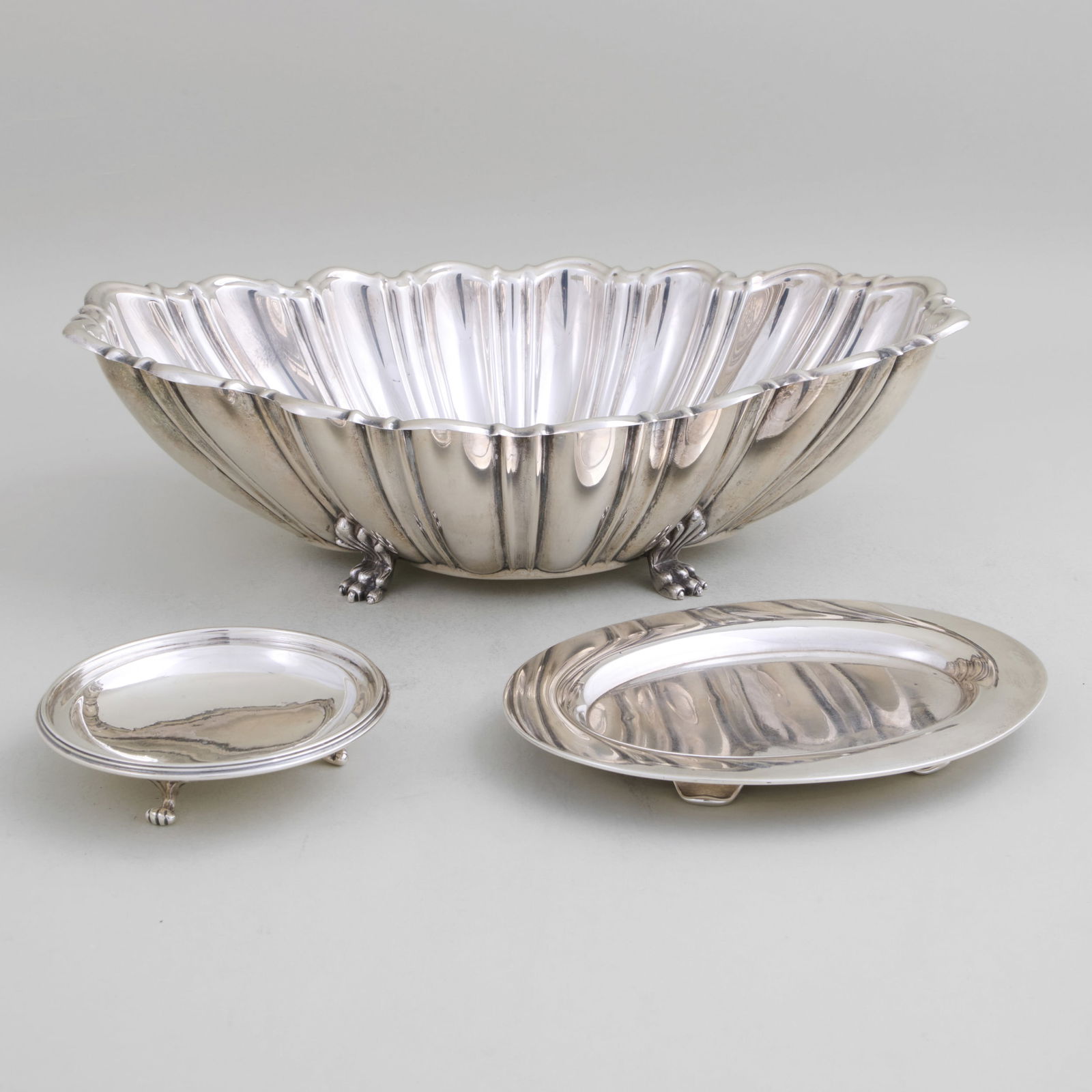 Group of Three Silver Serving Wares: Group of Three Silver Serving WaresComprising:An Asprey & Co. stand, maker's mark, London, 1910A Reed & Barton navette form bowl, marked 'Sterling'A Tiffany & Co. stand, marked 'Sterling'The largest