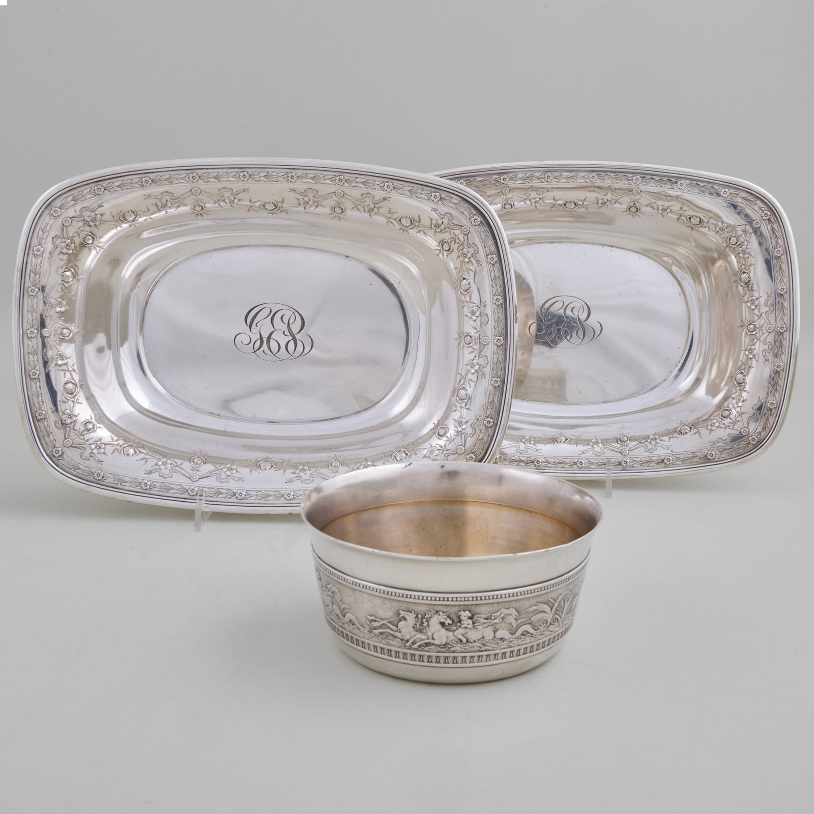 Pair of American Silver Serving Dishes and a Bowl: Pair of American Silver Serving Dishes and a Bowl Marked 'Sterling'. Comprising: A pair of Whiting Mfg. Co. serving dishes, monogrammed A Gorham child's bowl, inscribed 'Madeline, 1878' The pair 2 x 7