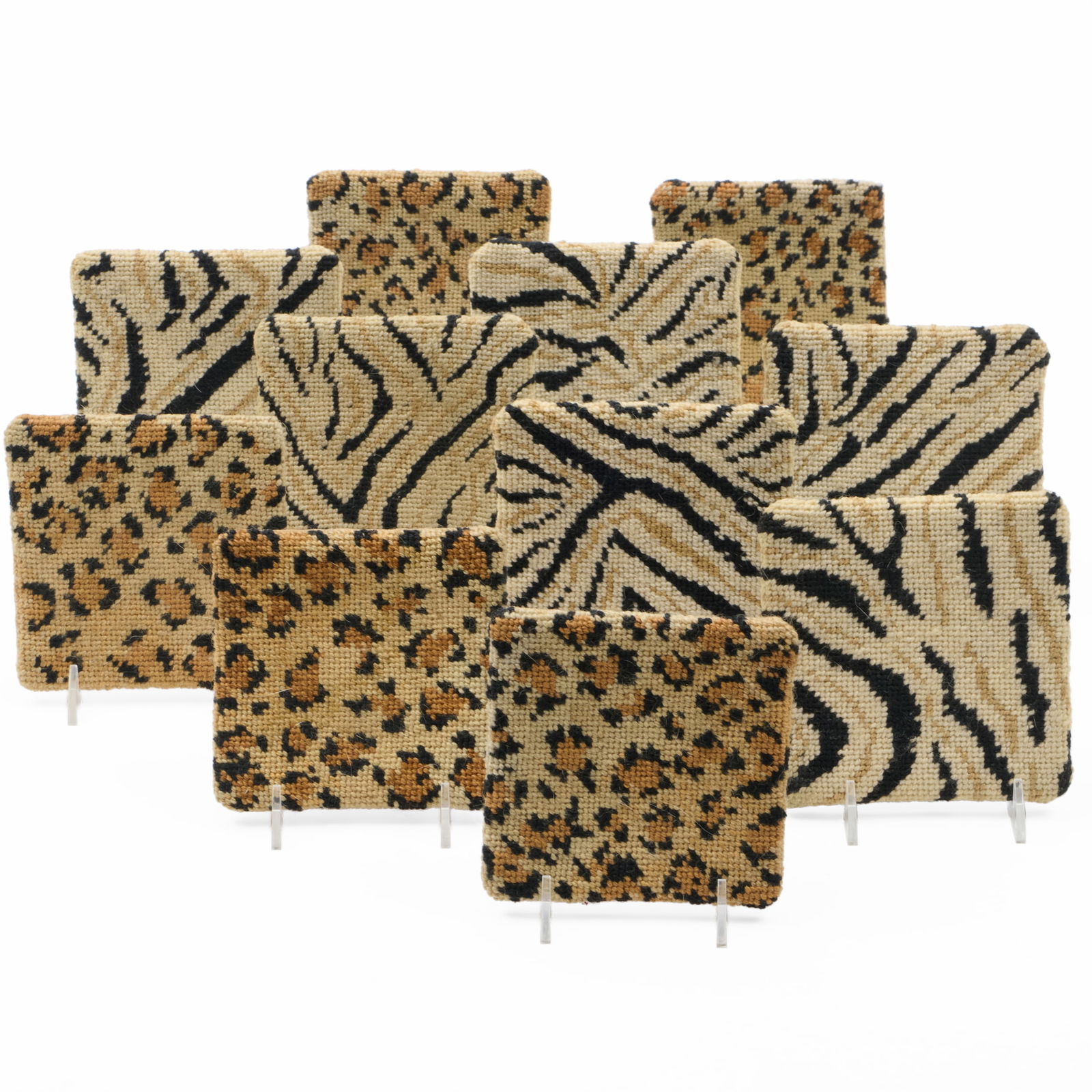 Eleven Animal Print Needlepoint Coasters: Eleven Animal Print Needlepoint Coasters 4 3/4 x 4 3/4 in. Collection of Lynn Chase from Money Pit Farm.