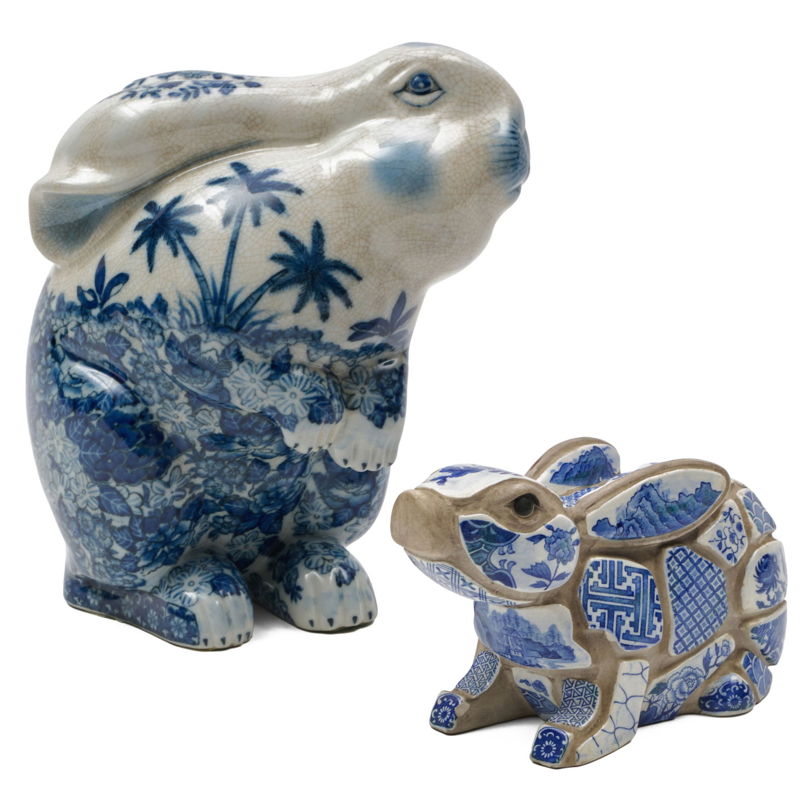 Two Blue and White Ceramic Models of Bunnies: Two Blue and White Ceramic Models of Bunnies The smaller marked for Tiffany & Co. The larger 10 3/4 x 5 1/2 x 9 3/4 in., the smaller 4 1/2 x 8 x 3 in. Collection of Lynn Chase from Money Pit Farm.