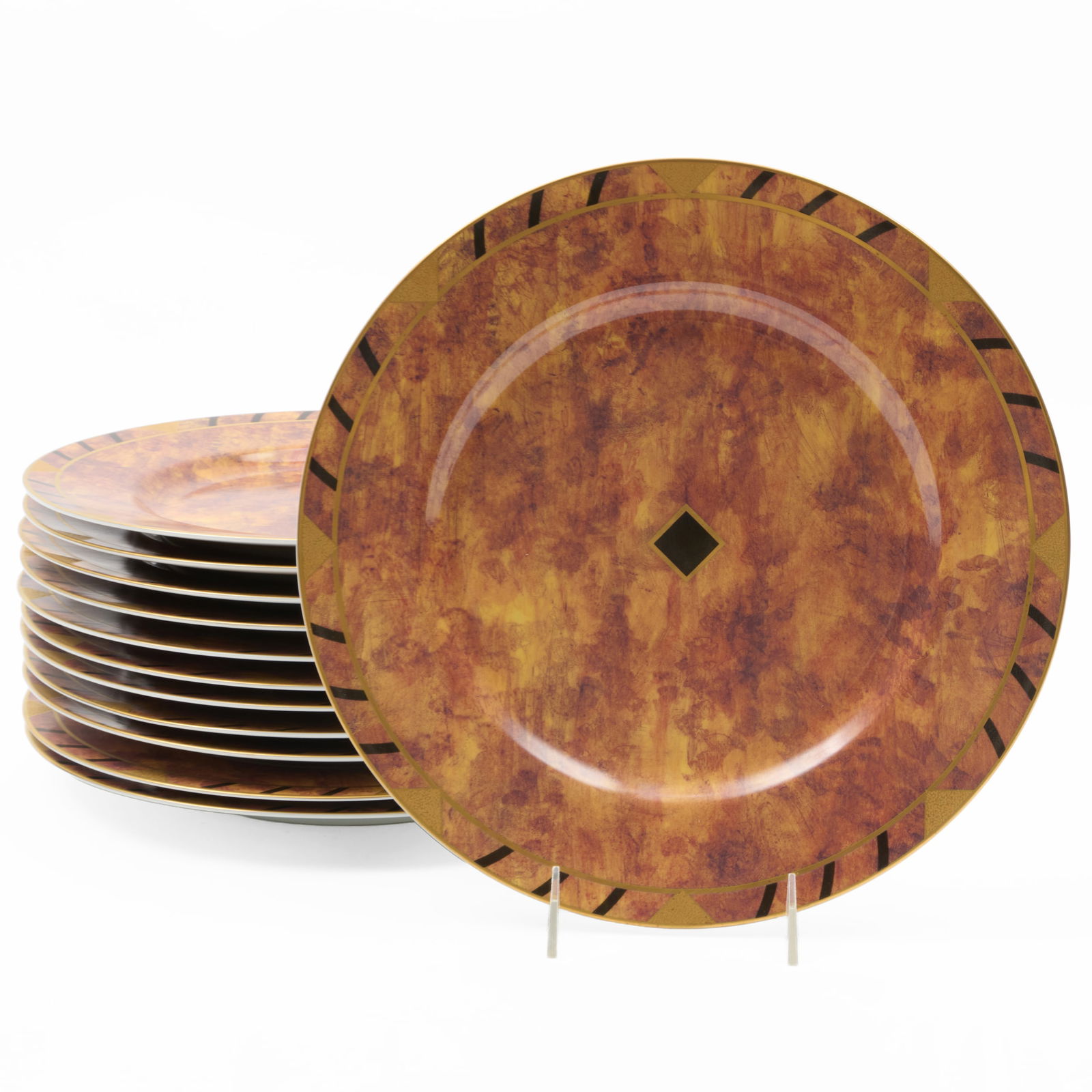 Set of Twelve Lynn Chase Porcelain Chargers in the 'African Portraits' Pattern: Set of Twelve Lynn Chase Porcelain Chargers in the 'African Portraits' PatternPrinted mark.12 in. diam.Collection of Lynn Chase from Money Pit Farm.