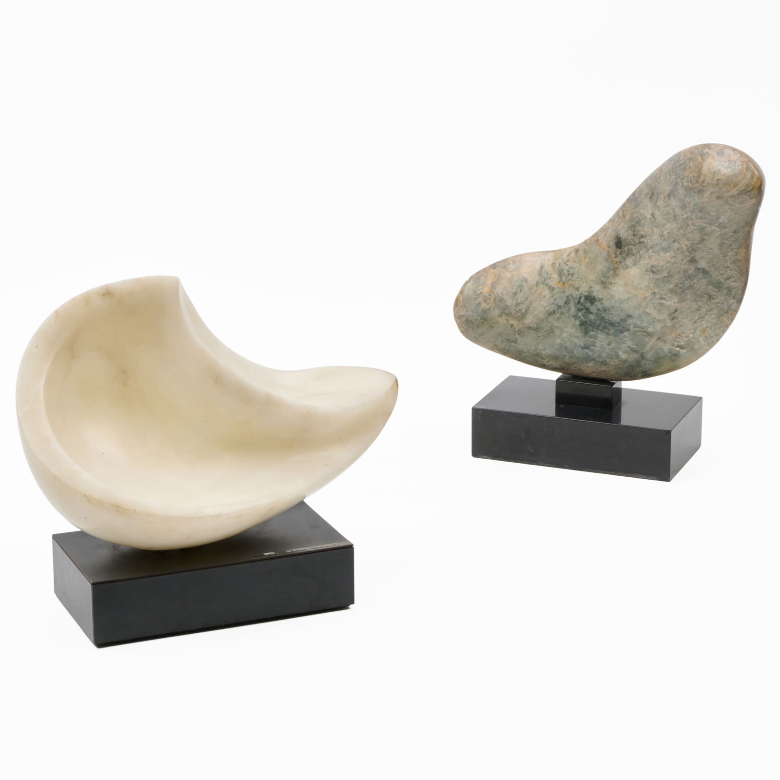 Lynn Chase (1948-2025): Sound: Lynn Chase (1948-2025): SoundAlabaster on a black composite base, unmarked; together with Seal, soapstone on a black stone base, unmarked.12 1/2 x 14 x 7 in., 13 1/2 x 14 x 5 in., both with