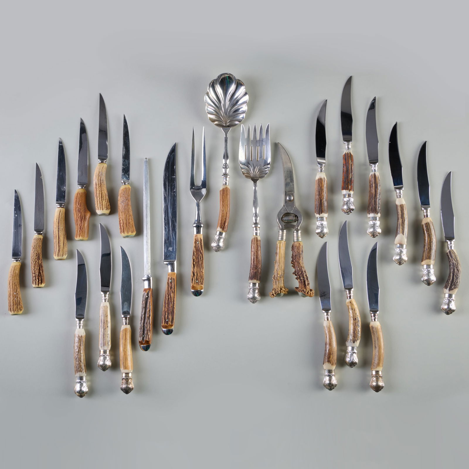 Assembled Horn Handled Flatware Service: Assembled Horn Handled Flatware ServiceComprising:Twelve Penshurst dinner knives with serrated steel bladesSix dinner knives with steel bladesA pair of poultry shears with steel bladesA carving set