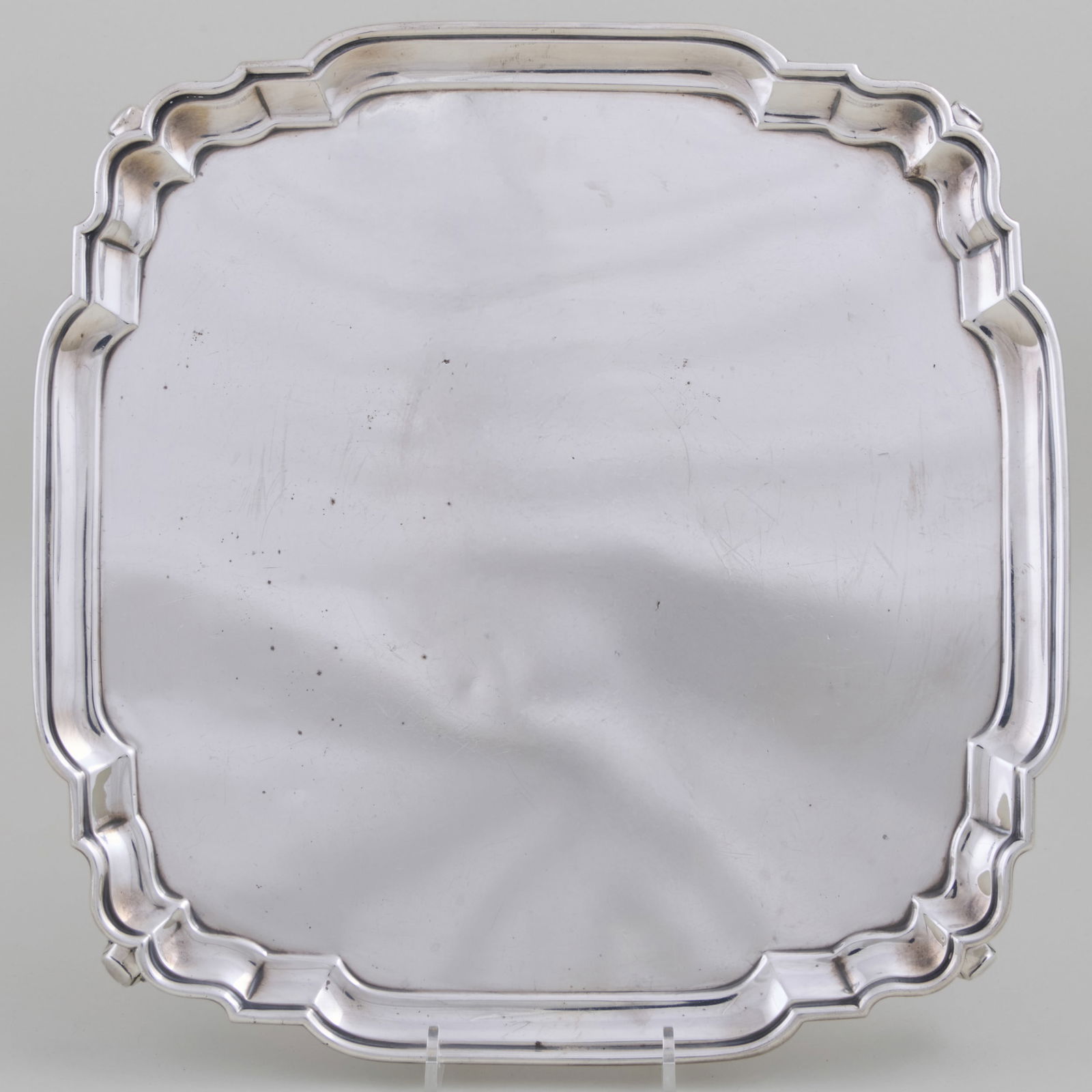 George V Silver Salver: George V Silver SalverMark of Crichton Bros., London, 1928.12 x 11 3/4 in., 33.2 oz. approx. weight.Collection of Lynn Chase from Money Pit Farm.